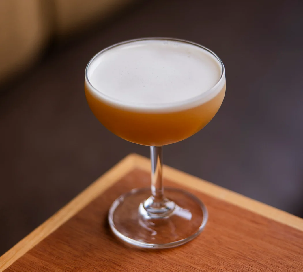Craft cocktail served in a coupe glass