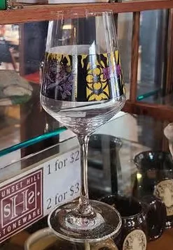Display of unique glassware and artisanal products in a cozy shop