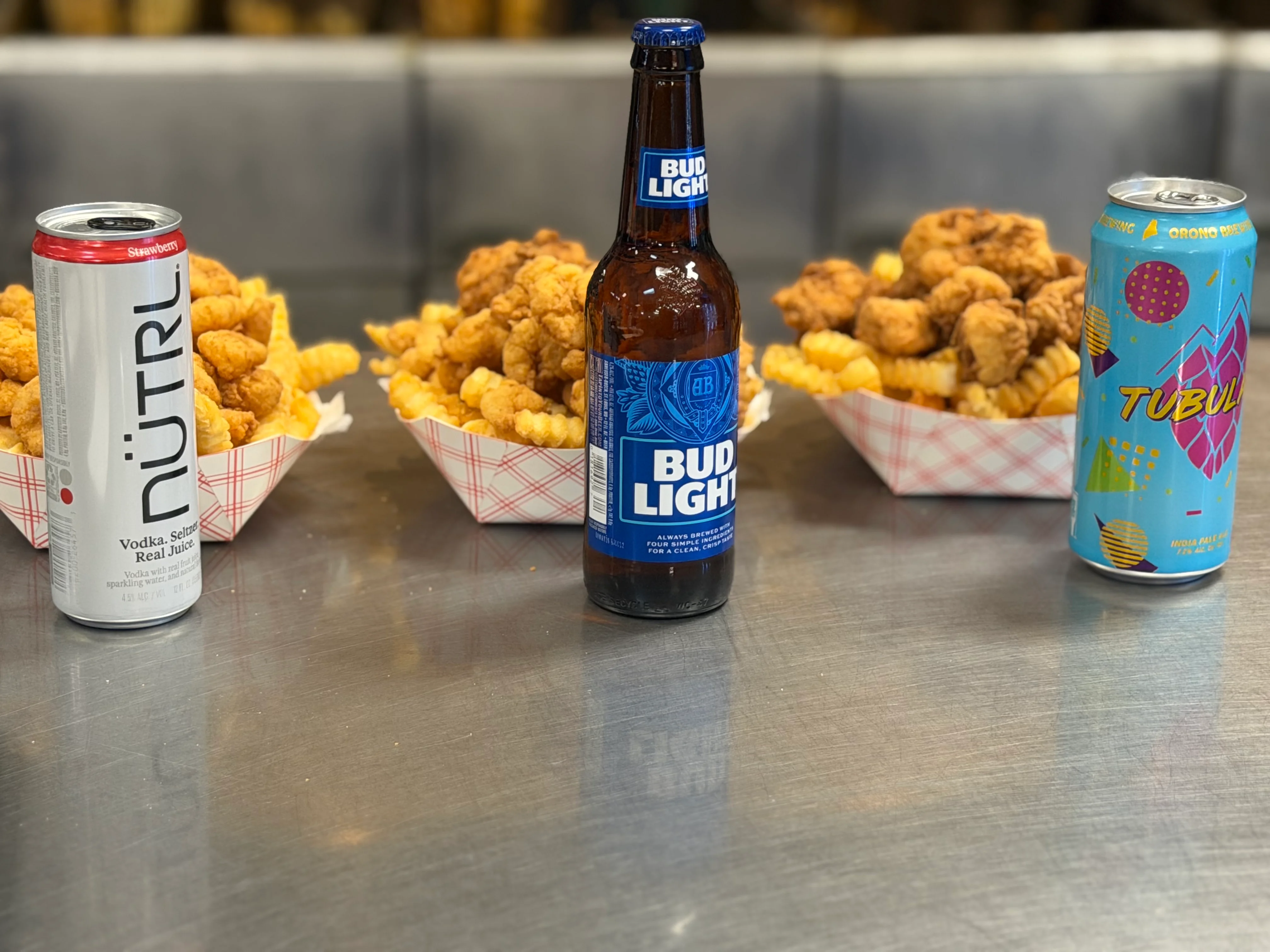 Crispy fried chicken with crinkle-cut fries and refreshing beverages