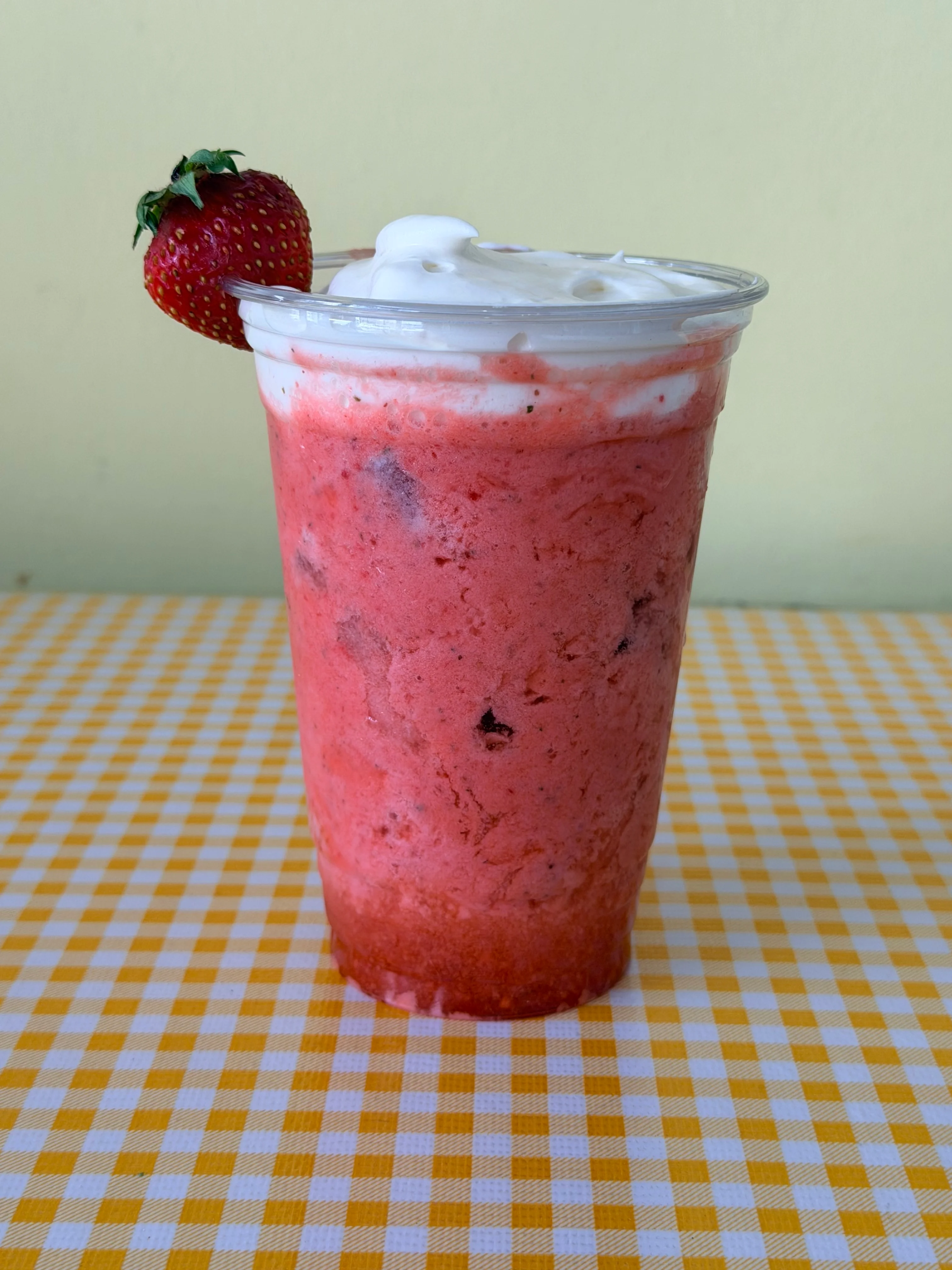 Refreshing strawberry milkshake topped with whipped cream