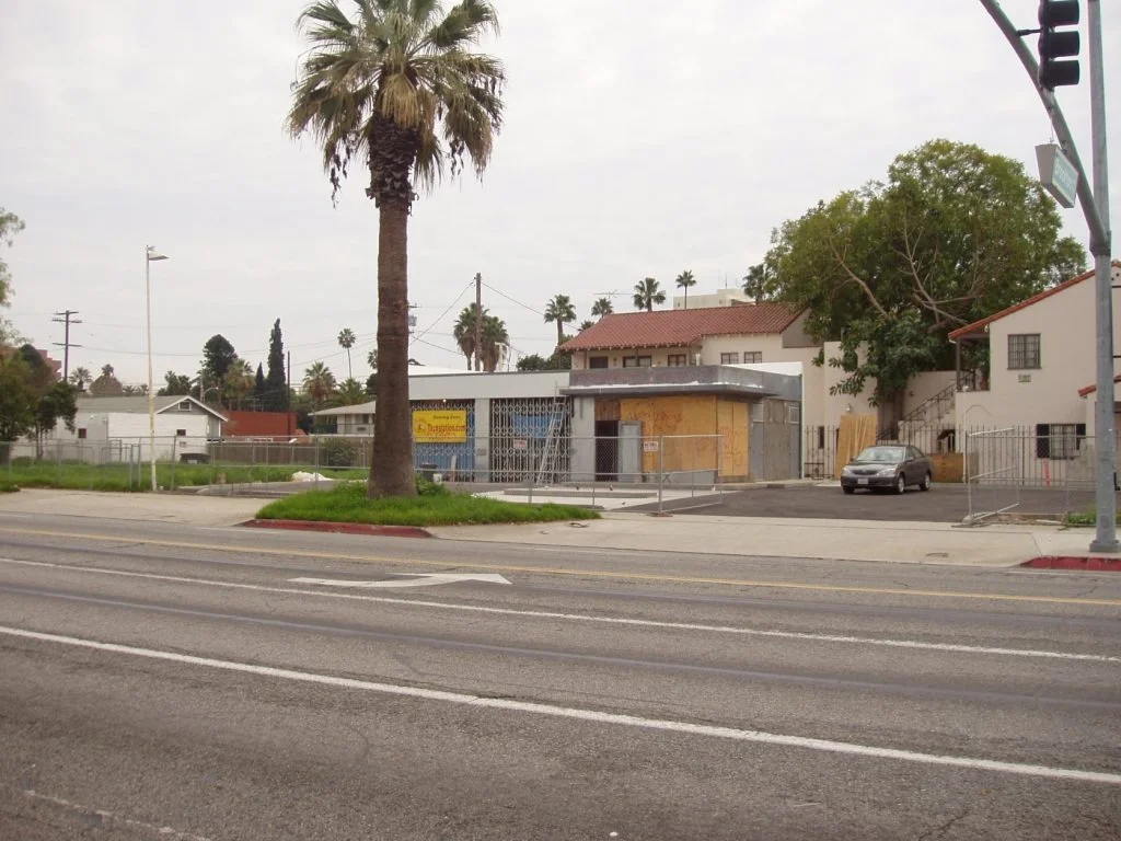 Newly constructed restaurant building with palm trees