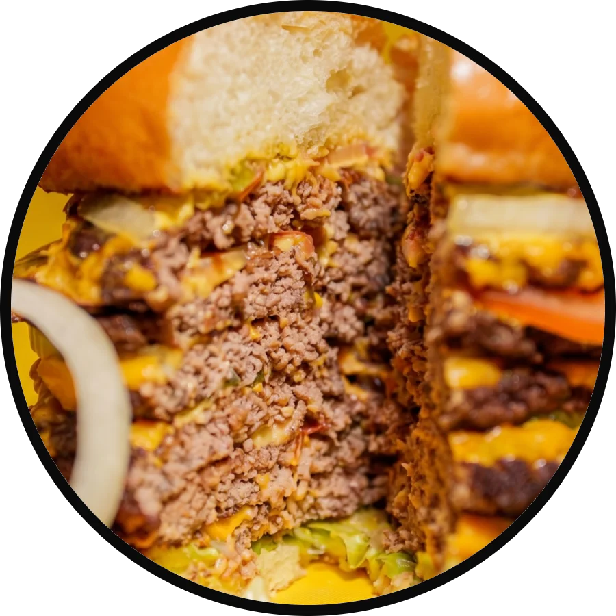 Juicy cheeseburger stacked with layers of beef and cheese