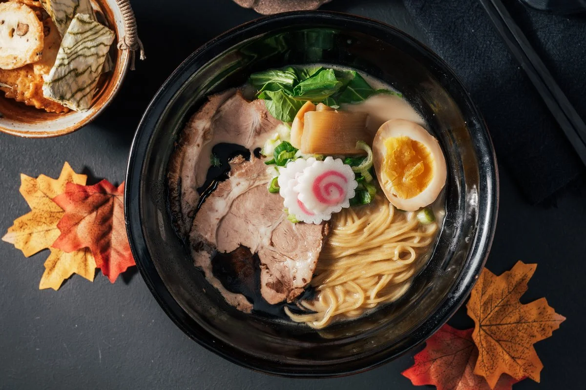 A bowl of Tonkotsu Ramen with rich broth and toppings.
