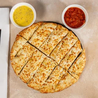 Cheesy garlic breadsticks with dipping sauces