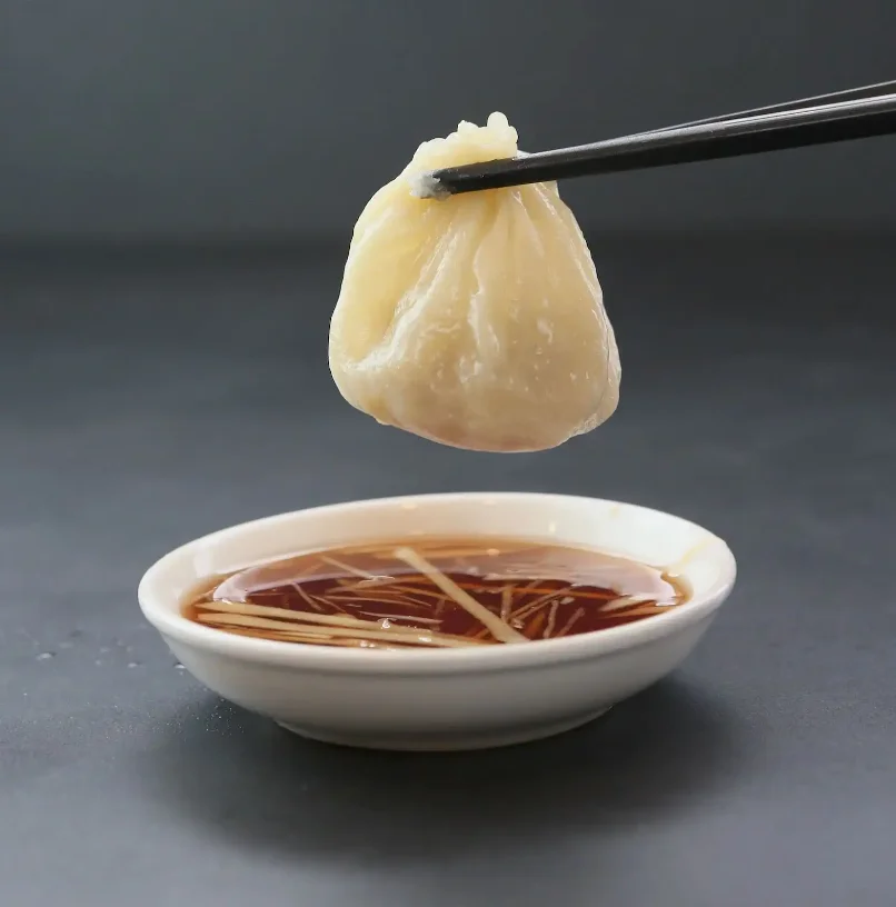 Chinese xiao long bao dumpling with dipping sauce