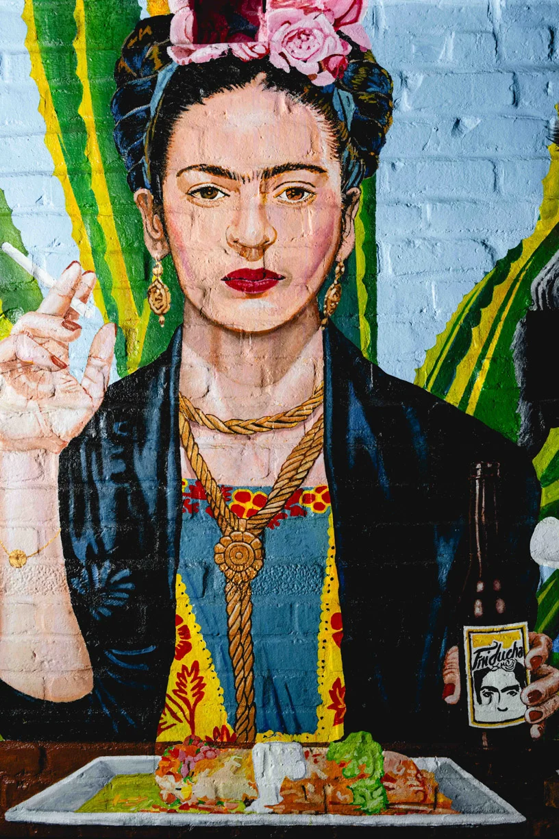 Colorful mural of Frida Kahlo at Friducha, a Mexican restaurant in Brooklyn, NY.