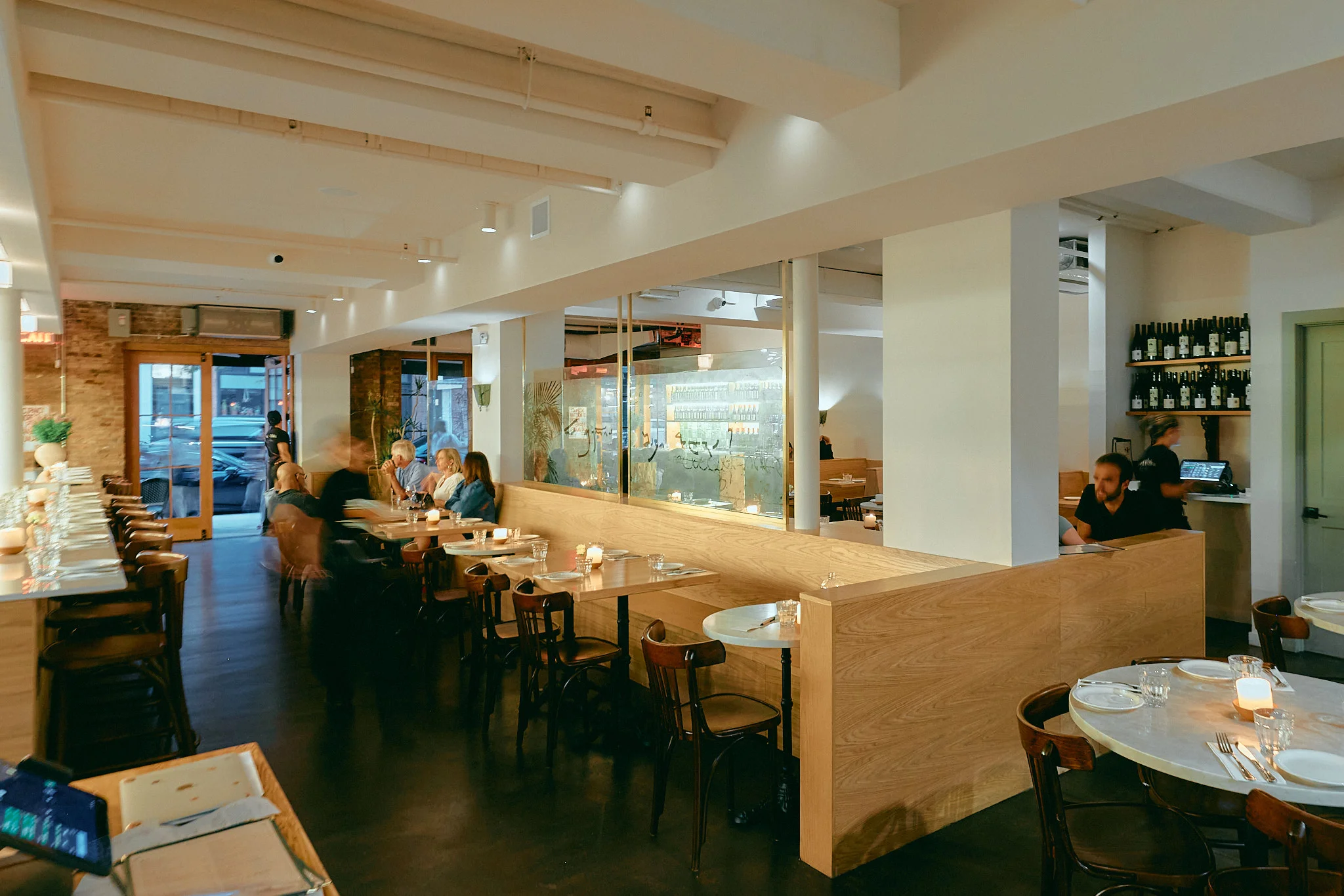 Cozy restaurant interior with warm lighting and wooden accents