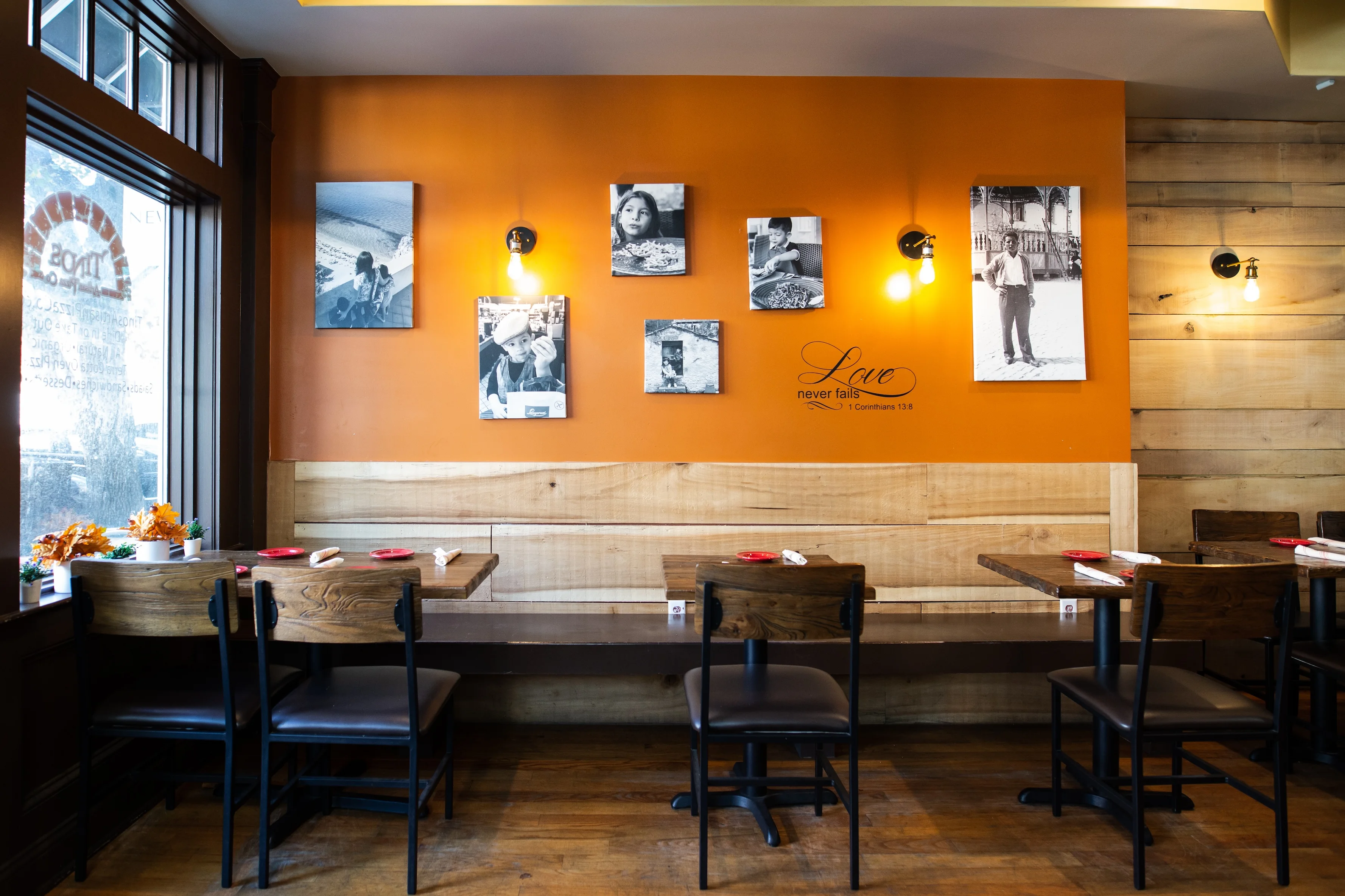 Cozy restaurant interior with warm orange walls and wooden decor