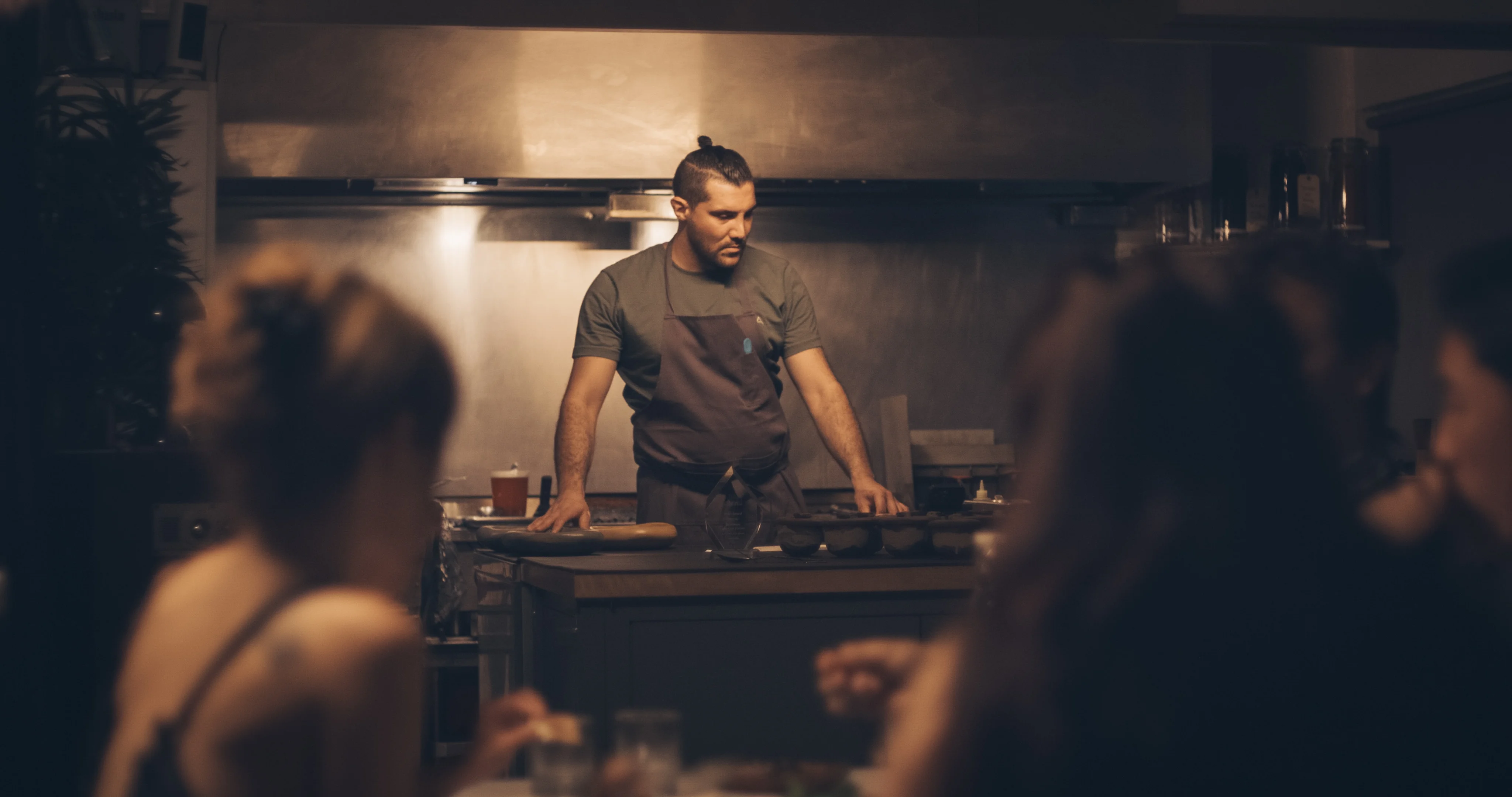 Chef preparing dishes in a cozy restaurant kitchen
