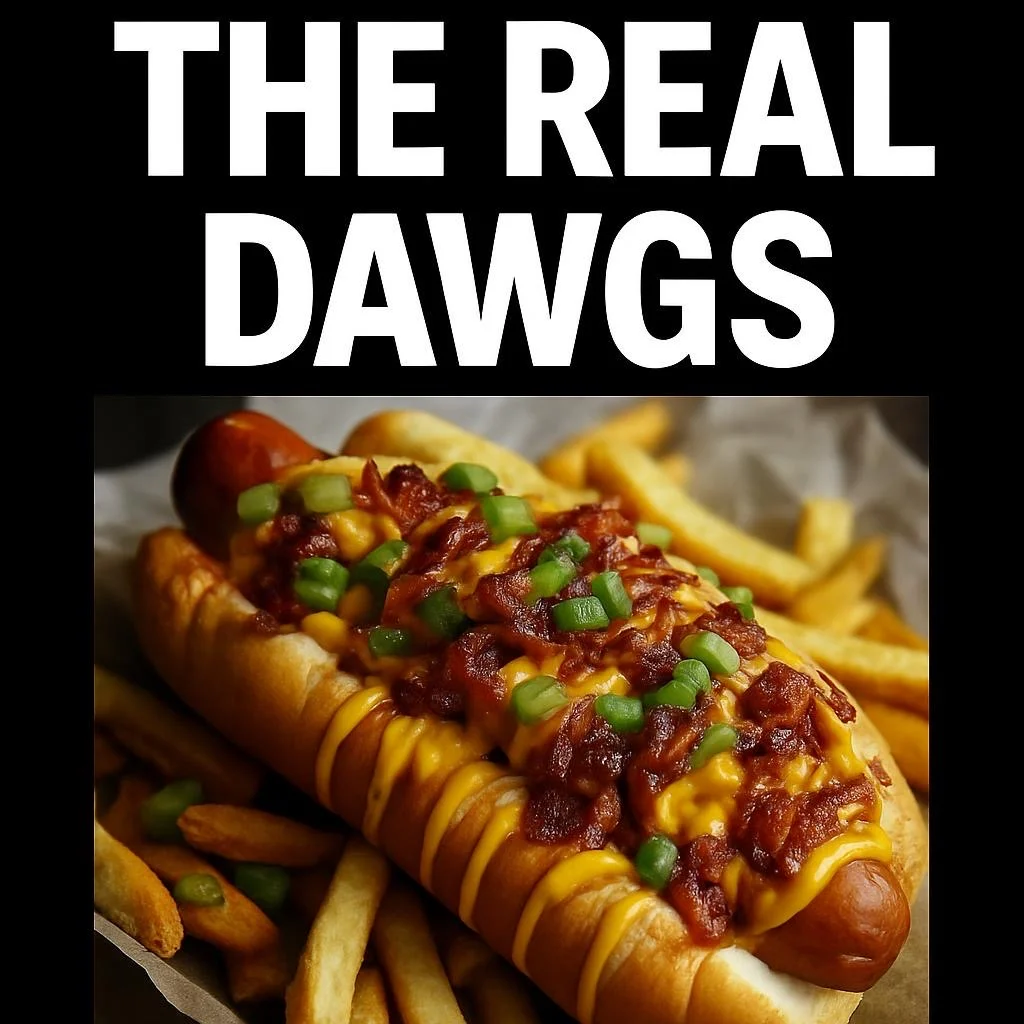 A loaded hot dog with bacon, cheese, and green onions, served with fries.
