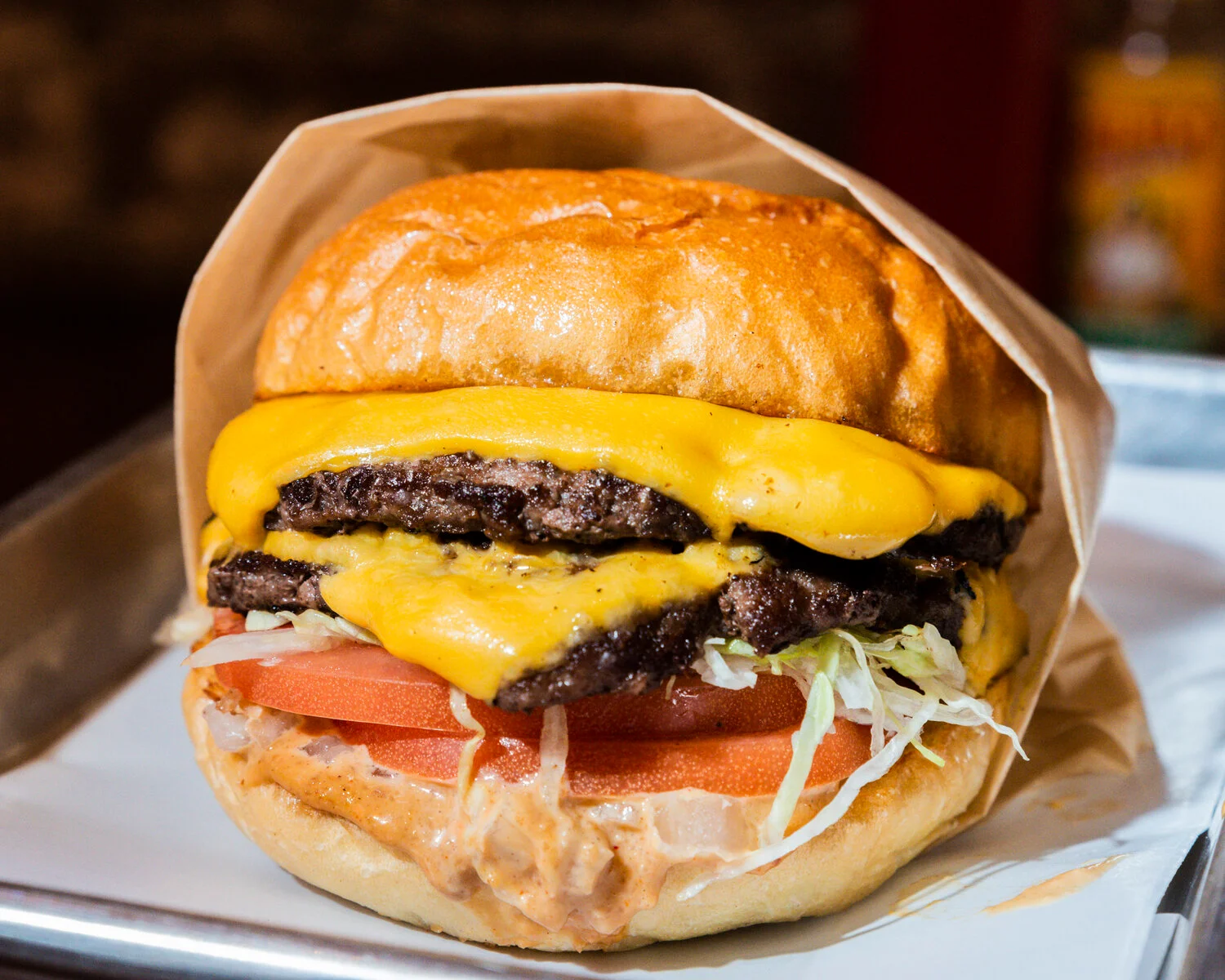 Double cheeseburger with melted cheese and fresh toppings