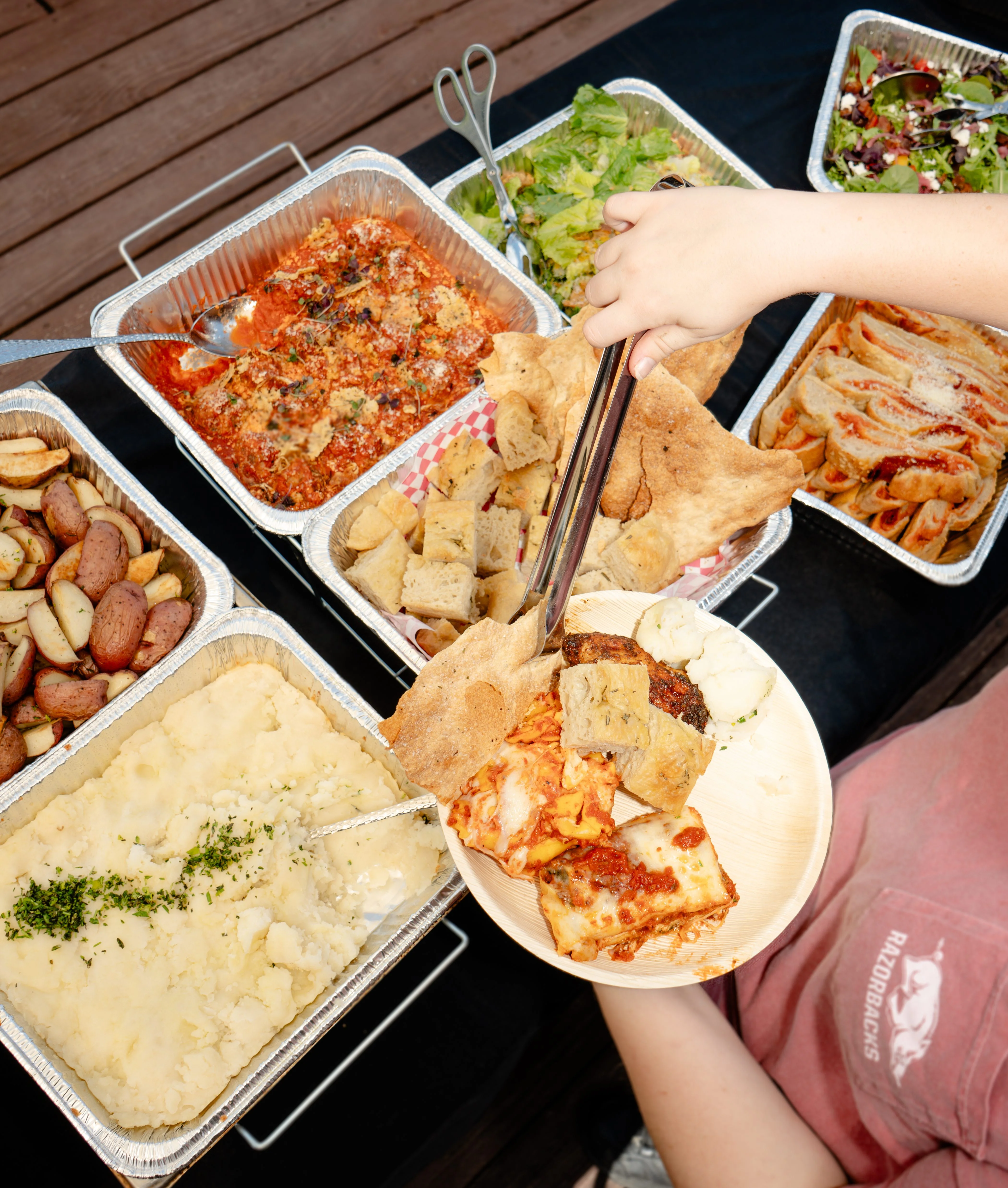 Assorted Italian dishes including lasagna and garlic bread
