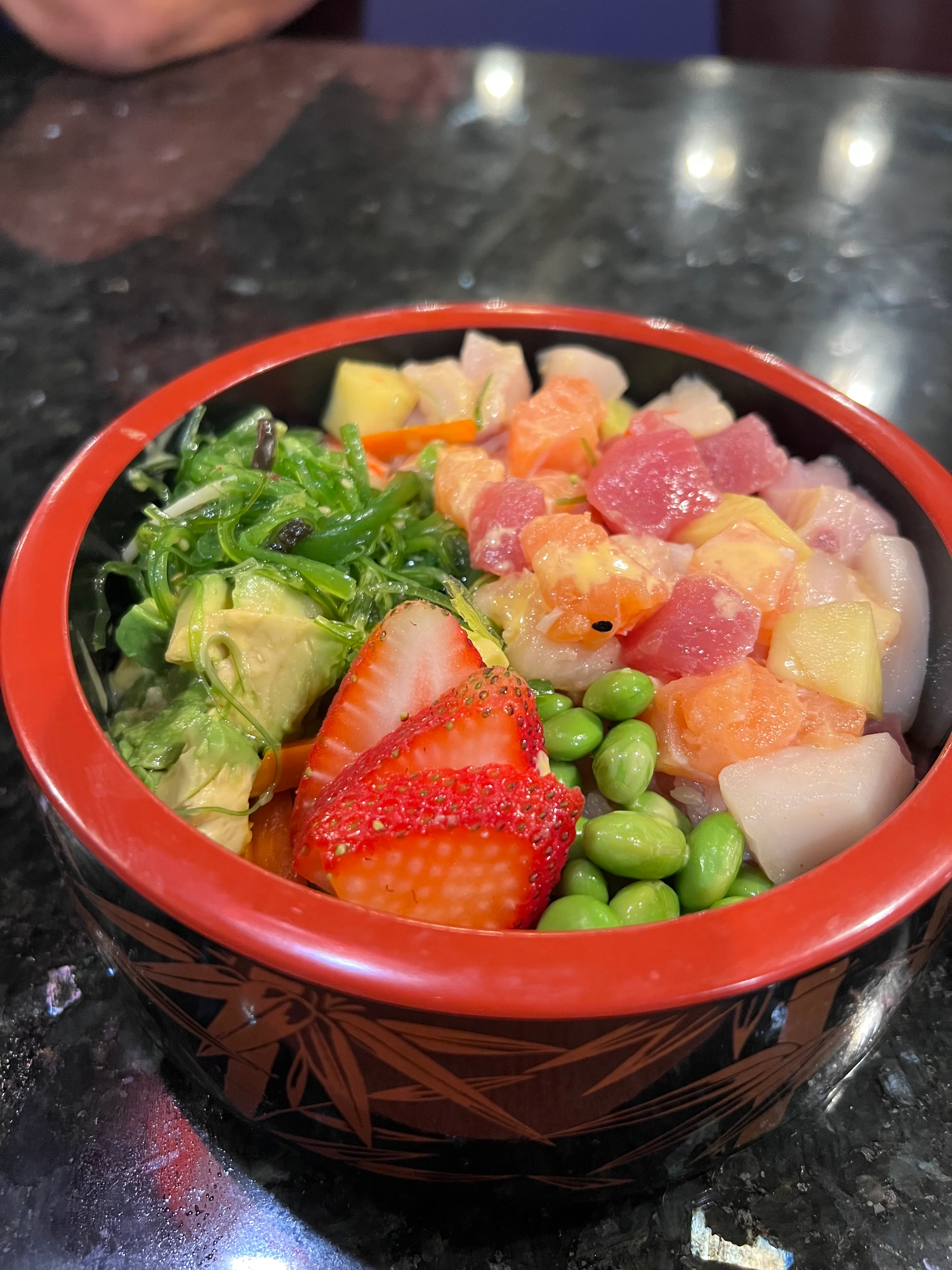 Colorful Japanese chirashi sushi bowl with fresh seafood and vegetables