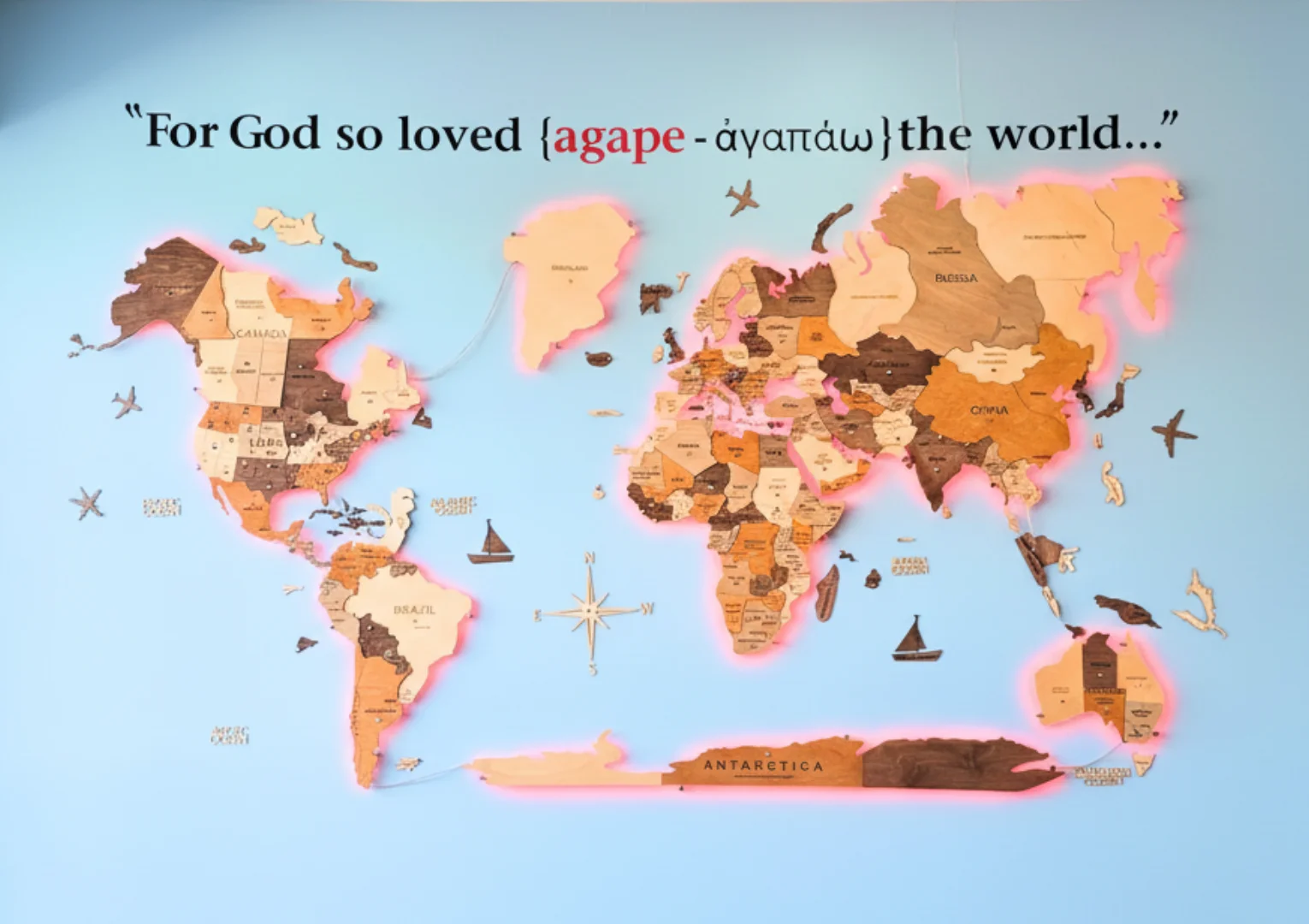 Artistic world map with inspirational quote on blue wall