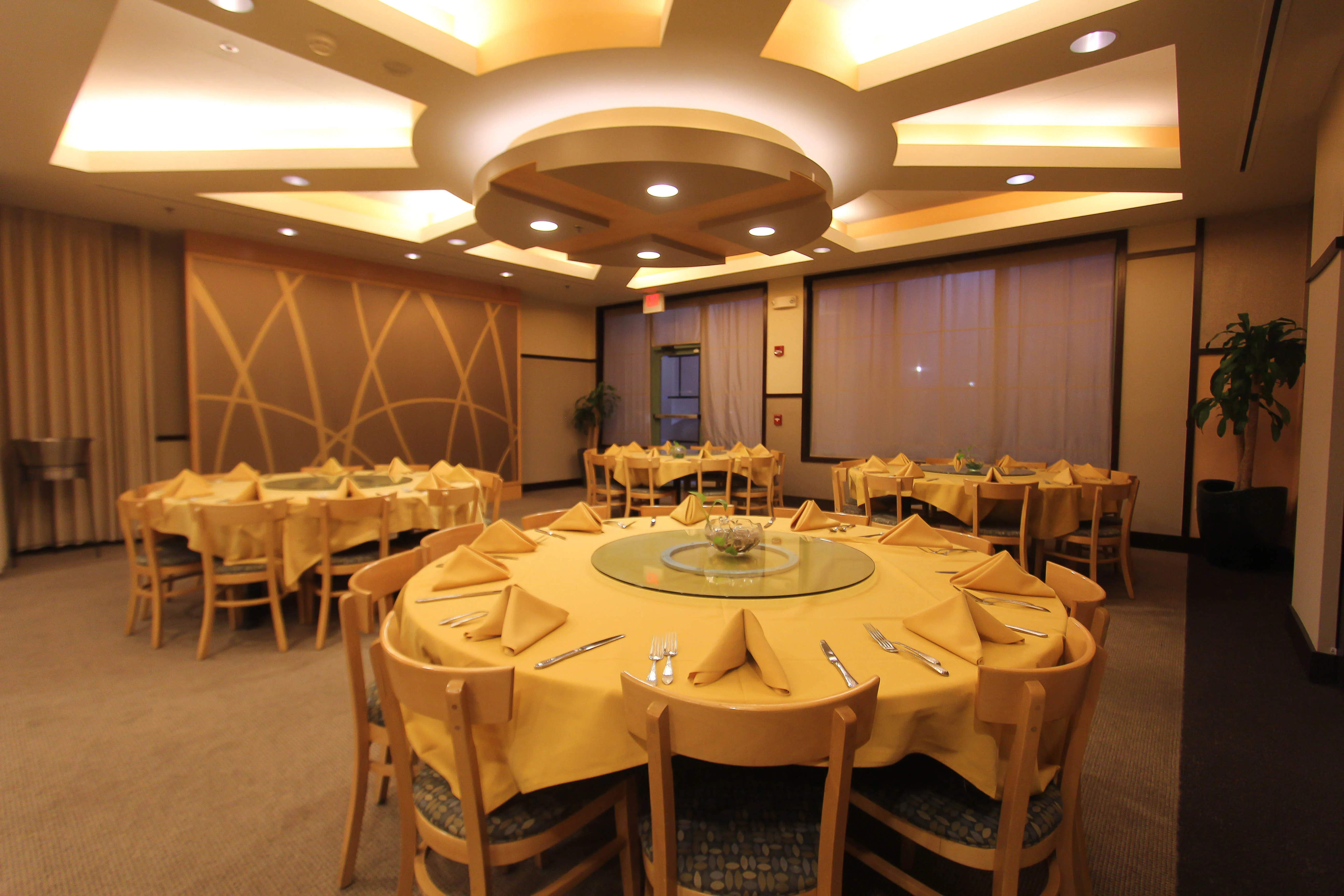 Elegant restaurant dining area with round tables and soft lighting