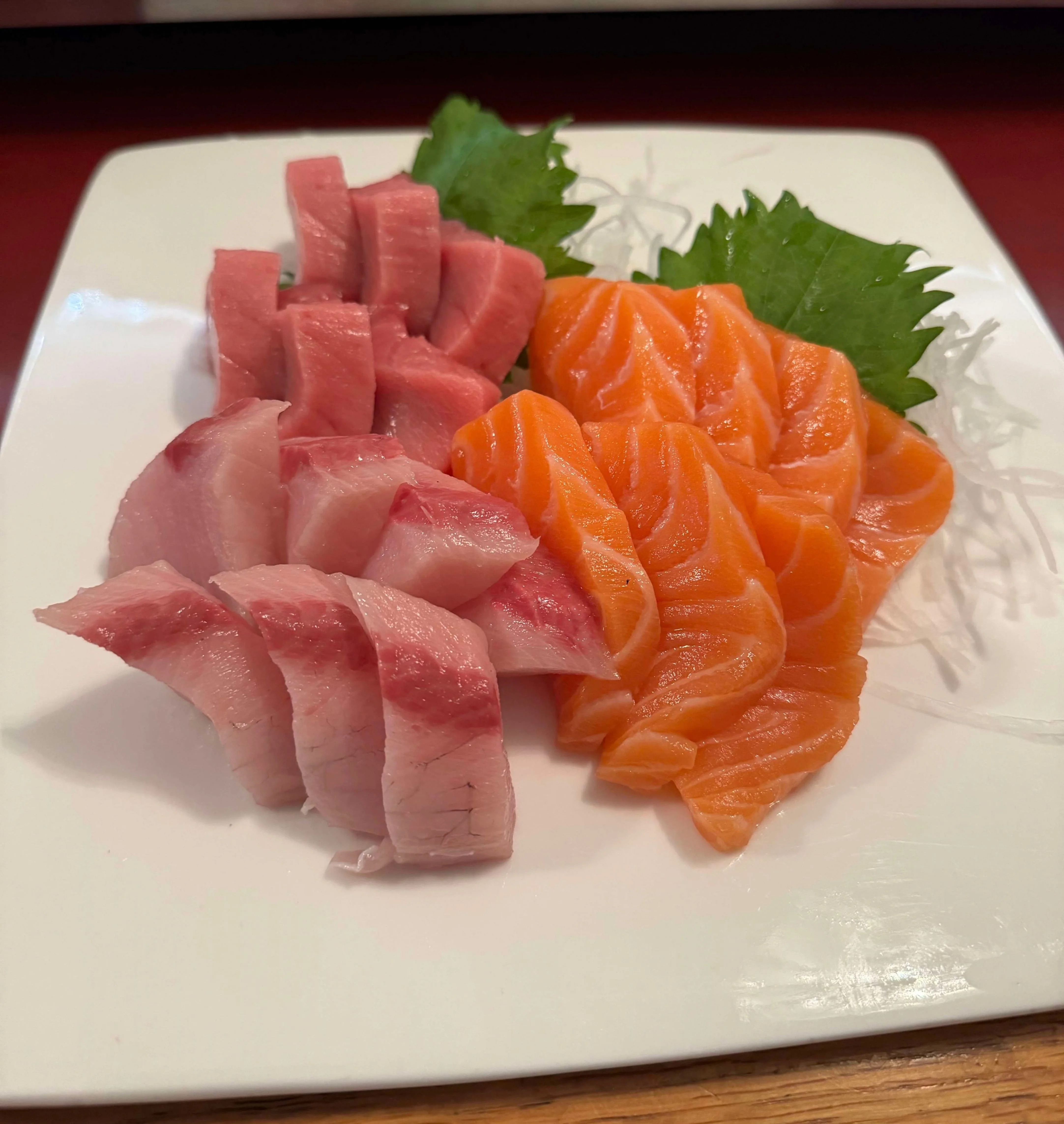 Japanese sashimi platter featuring fresh salmon and tuna slices