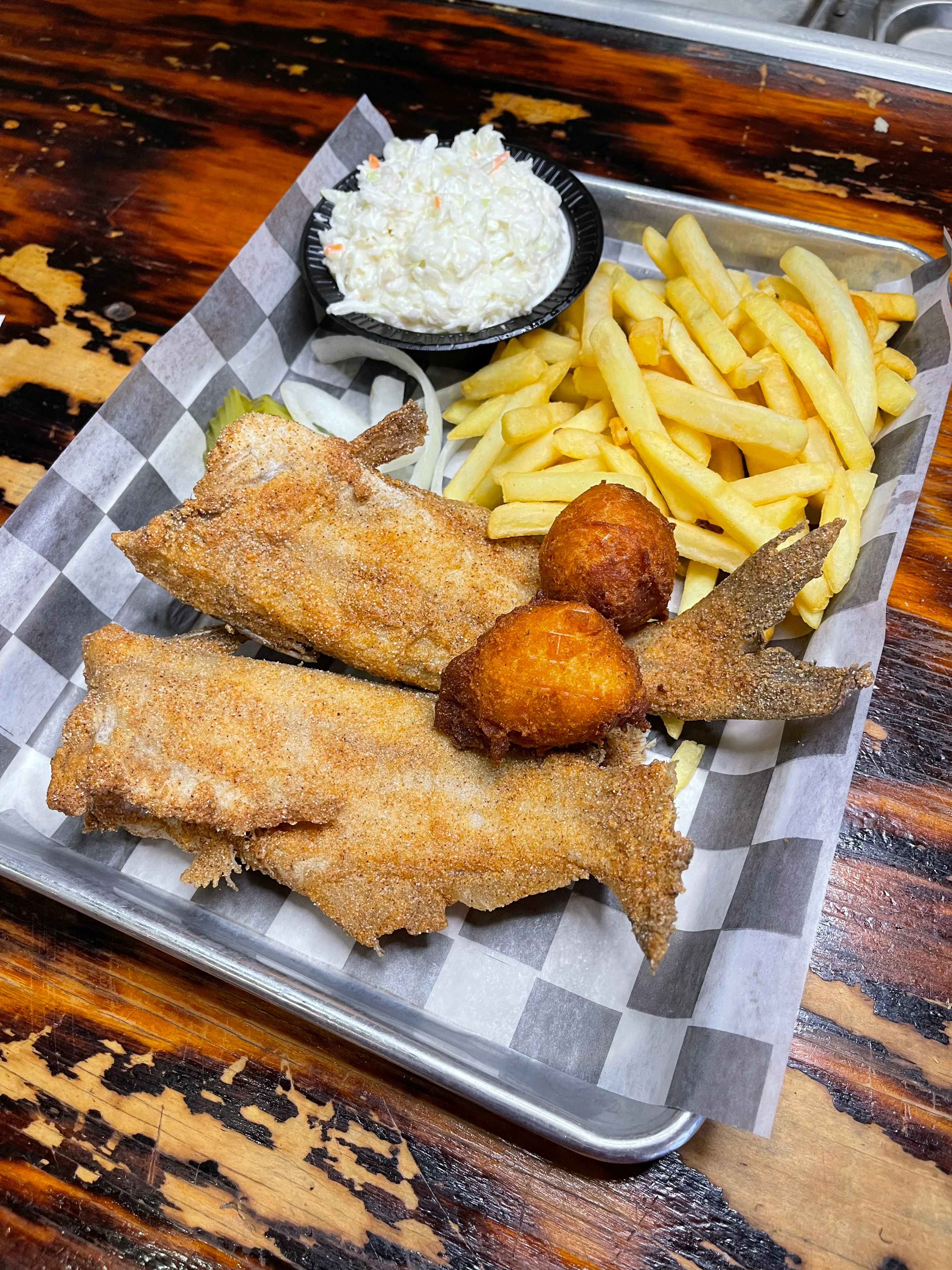 Southern fried catfish platter with fries and coleslaw