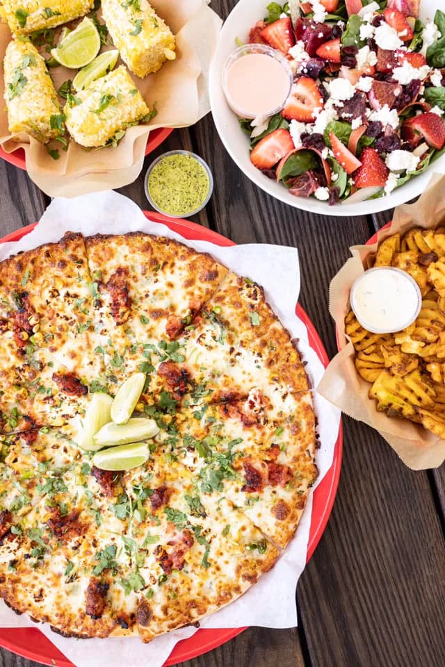 Mexican-style pizza topped with cilantro and lime
