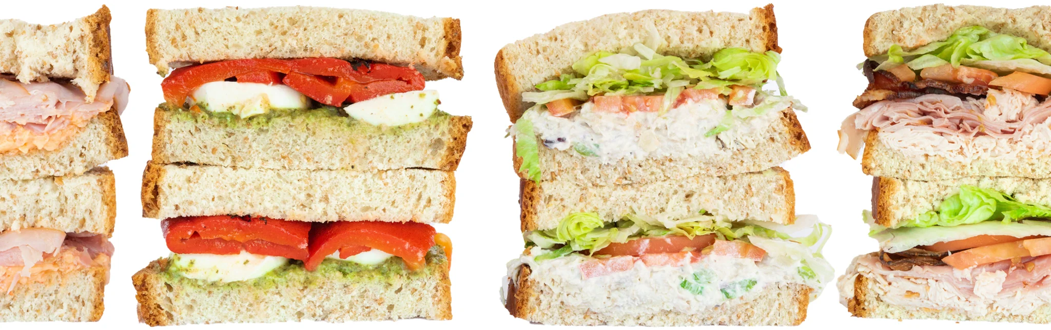 Assorted gourmet sandwiches on whole grain bread