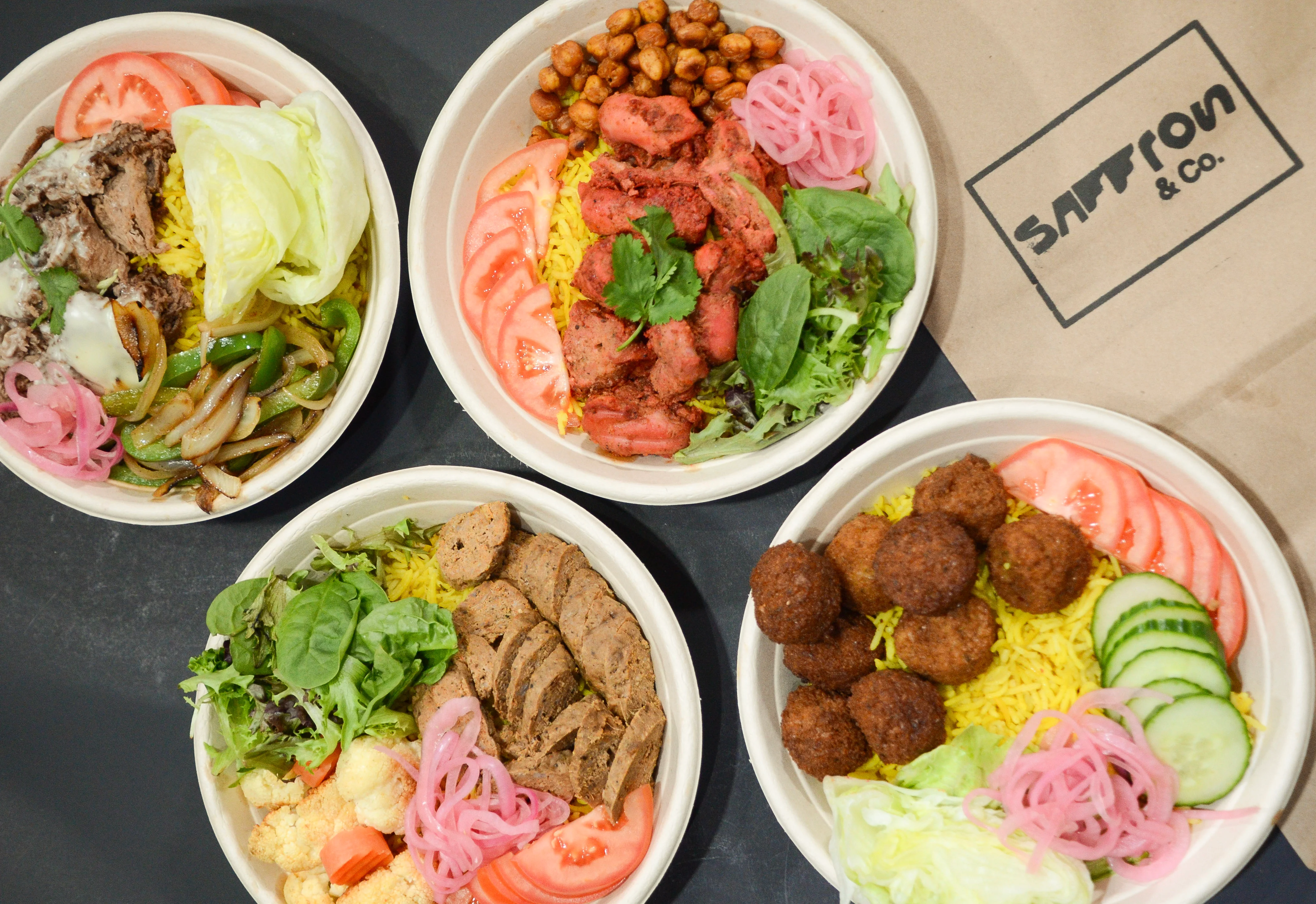 Assorted Indian biryani bowls with vibrant toppings
