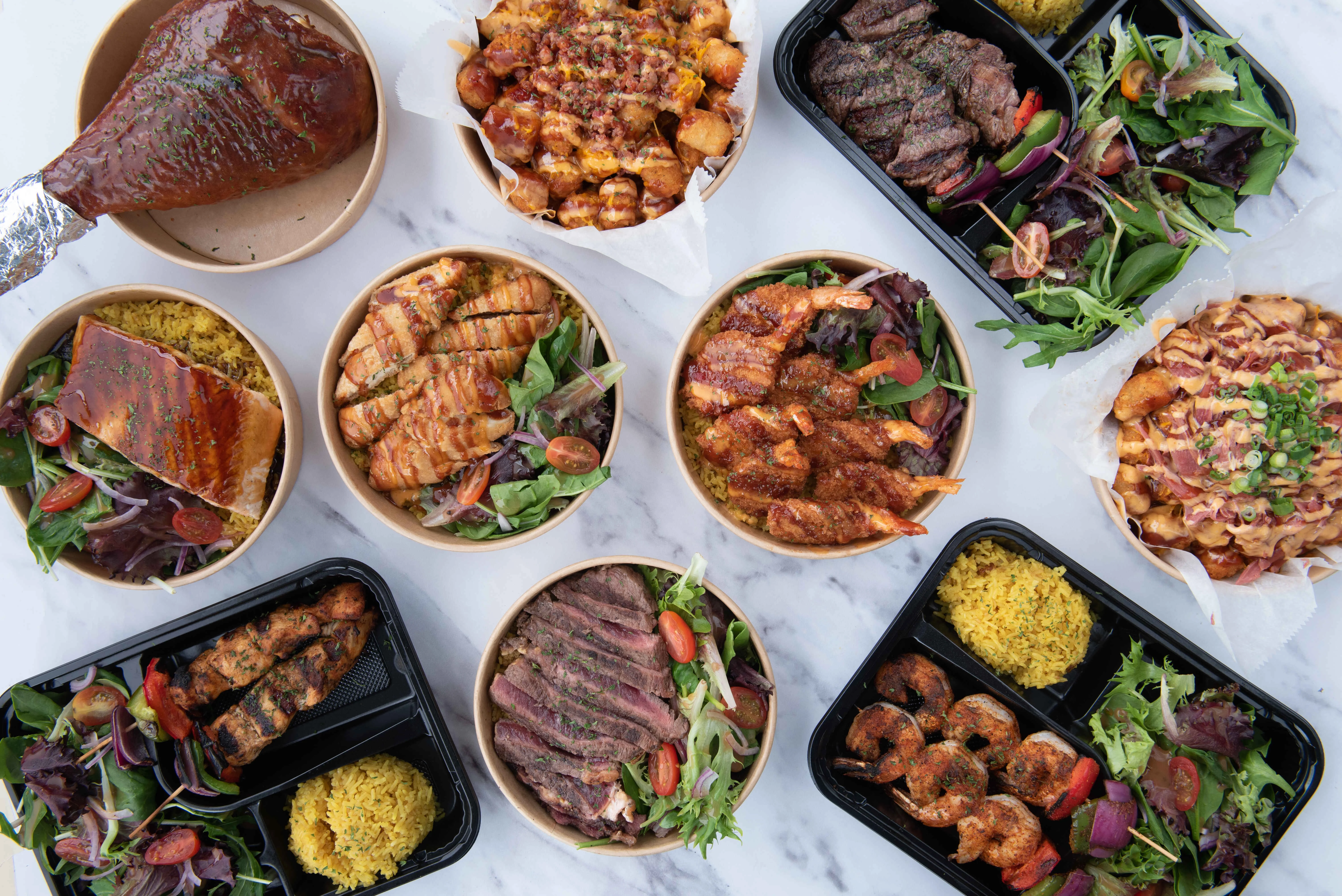 Assorted grilled meats and seafood in a vibrant platter