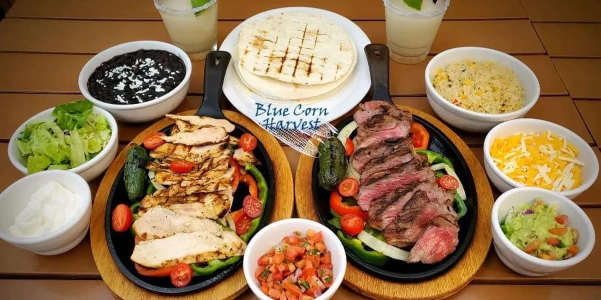 Sizzling fajitas platter with grilled chicken and steak