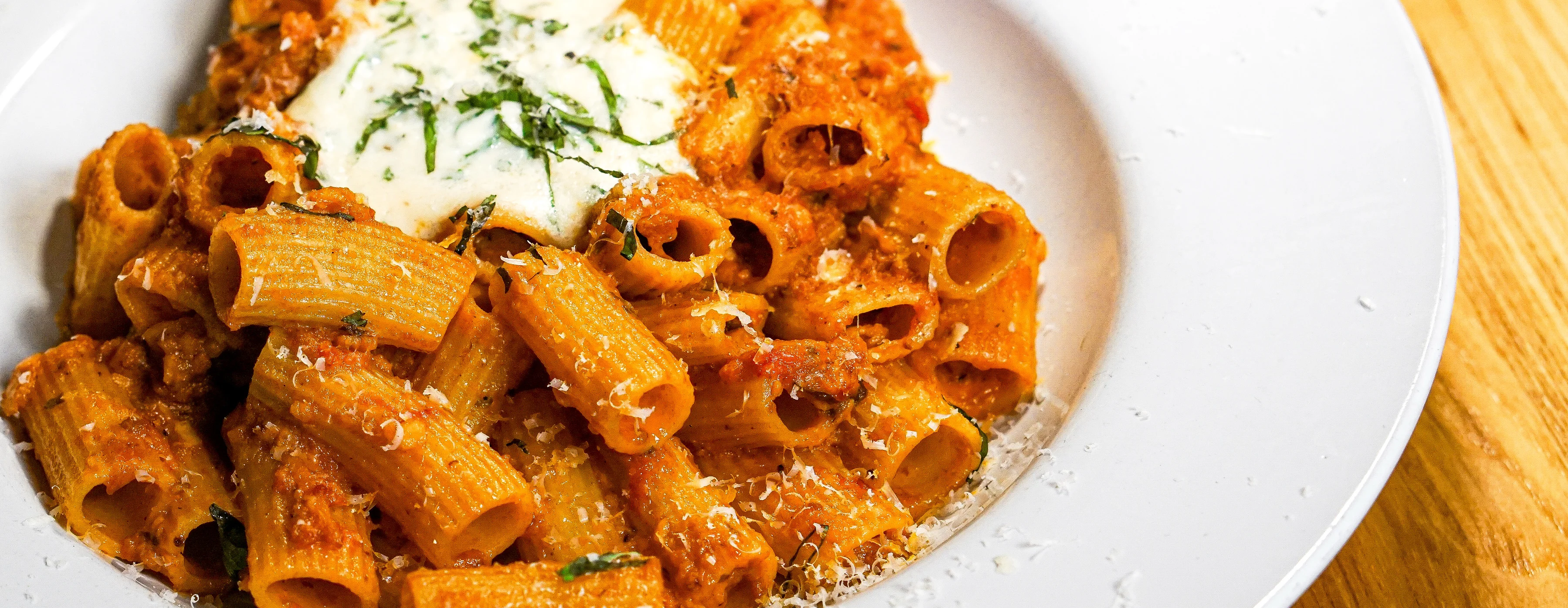 Warm Bowl of Bolognese Rigatoni with Herbed Ricotta