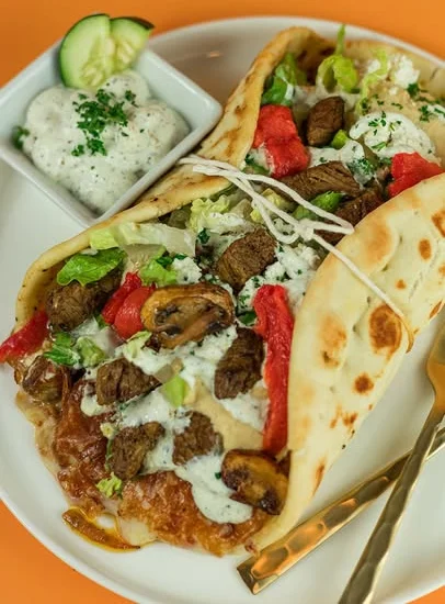 Build your own Greek pita with gyro meat roasted peppers and tzatziki at Santorini's West Bountiful