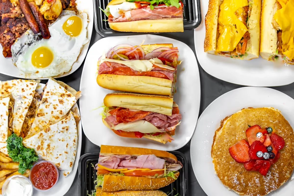 Variety of American comfort food including sandwiches and pancakes