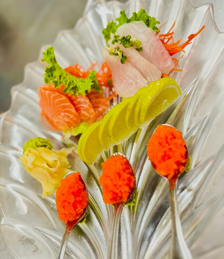Japanese sashimi platter with fresh fish and garnishes