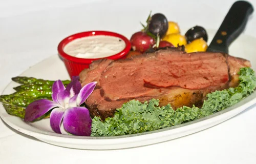 Succulent prime rib served with asparagus and dipping sauce