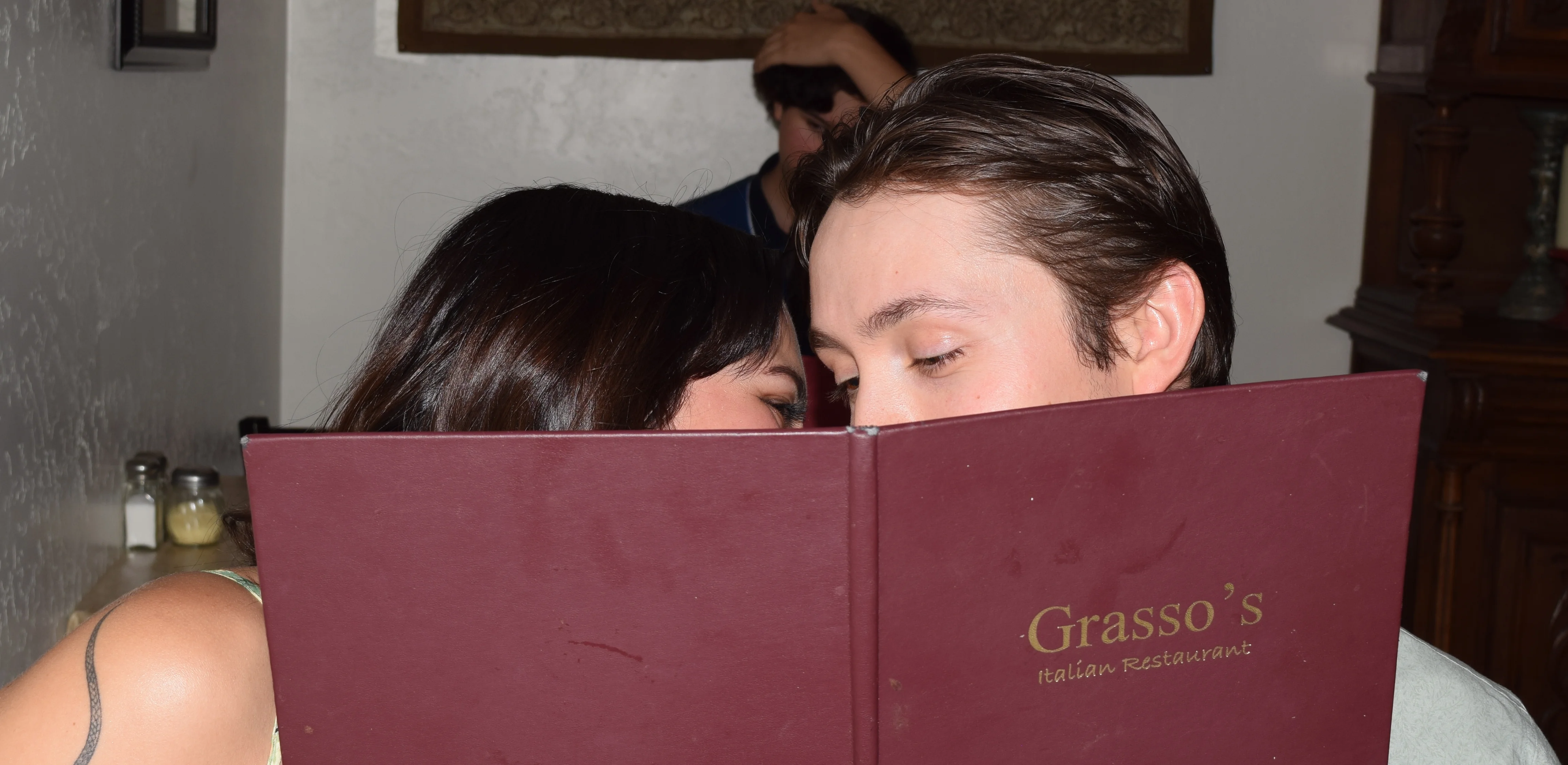 Couple sharing a moment at an Italian restaurant