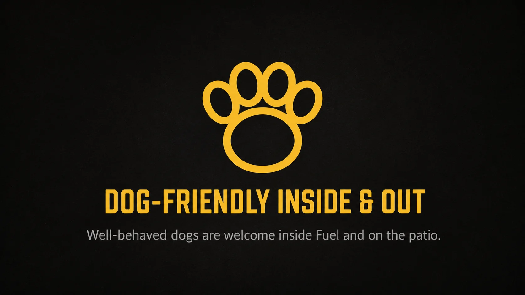Signage for a pet-friendly patio welcoming well-behaved dogs