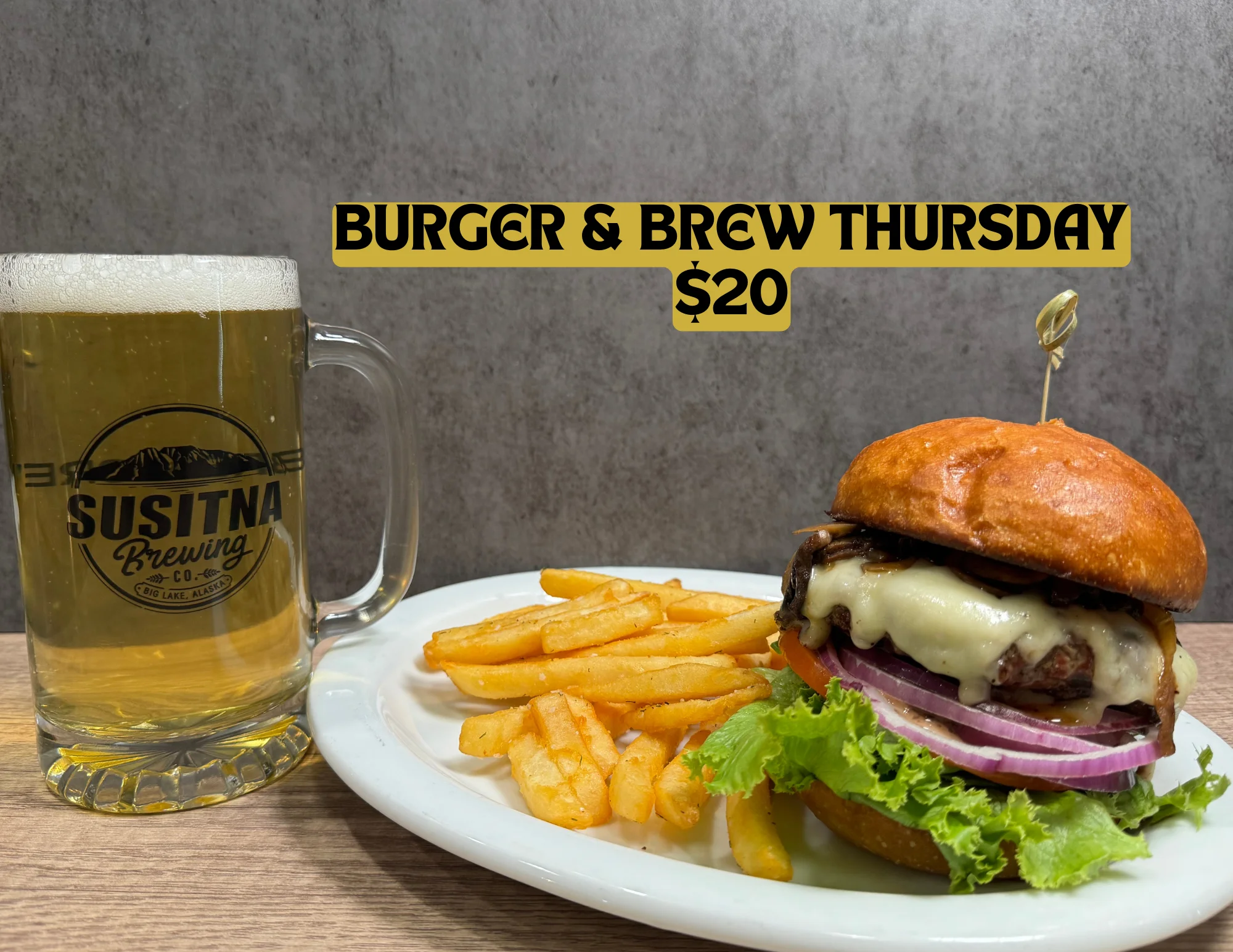 Juicy burger with fries and craft beer for Burger & Brew Thursday