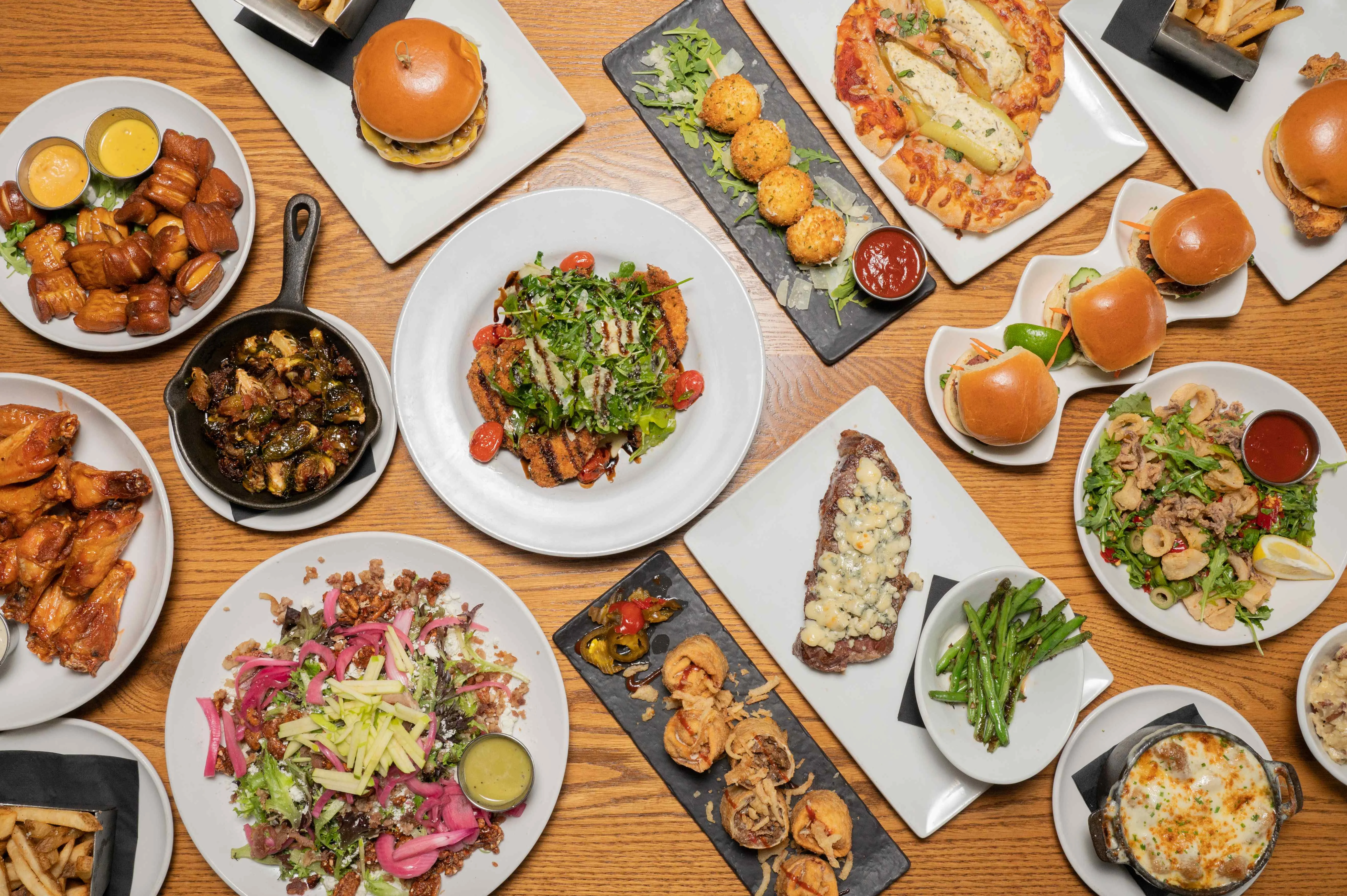 Assorted American comfort food dishes on a wooden table