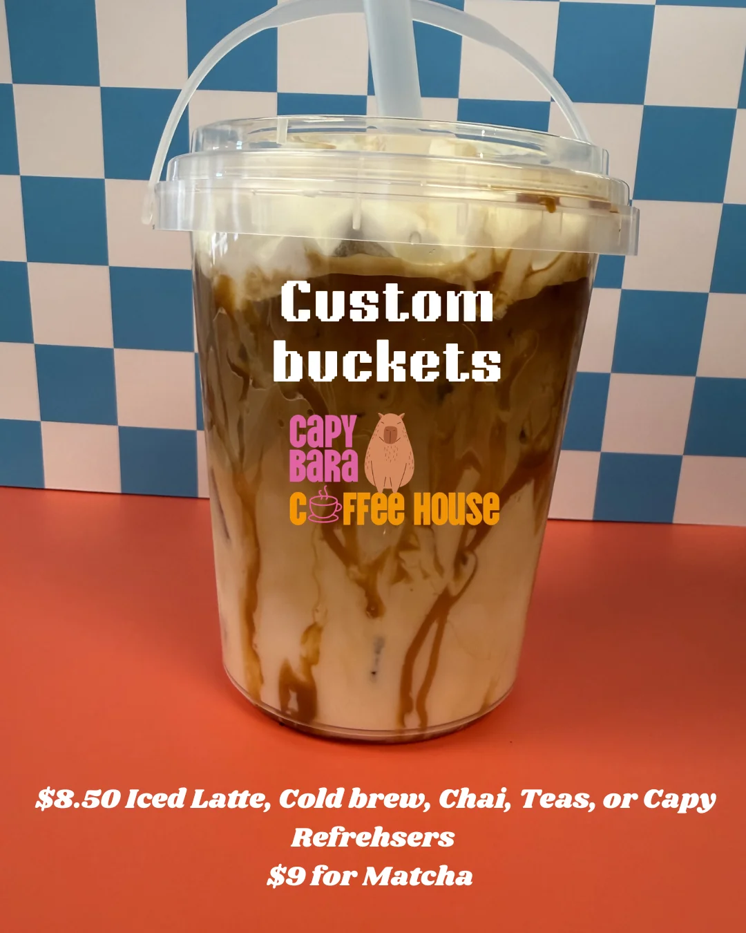 Custom iced latte in a clear cup with whipped cream