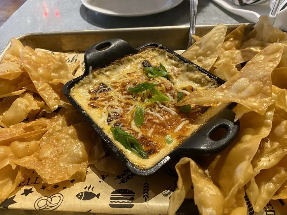 Cheesy Mexican queso dip with crispy tortilla chips