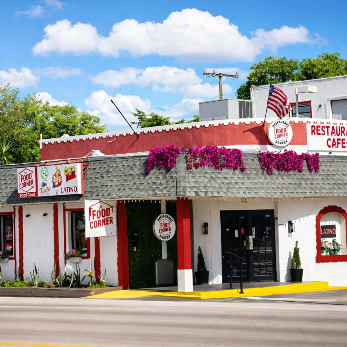 Charming restaurant exterior with vibrant flowers and signage