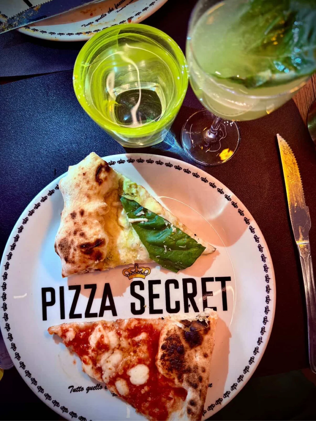 Pizza Secret pizza on the branded Pizza Secret plate