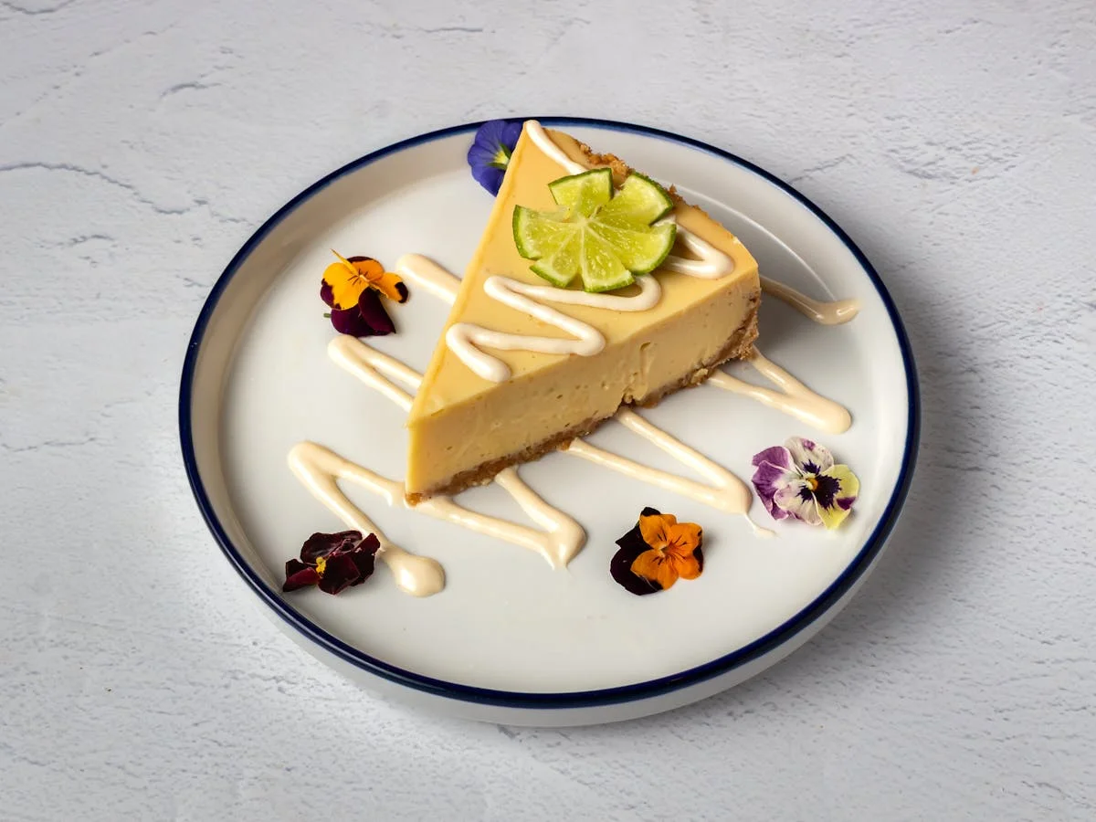 House-made key lime cheesecake — Italian dessert at Amici Brick Oven Pizza in West Palm Beach