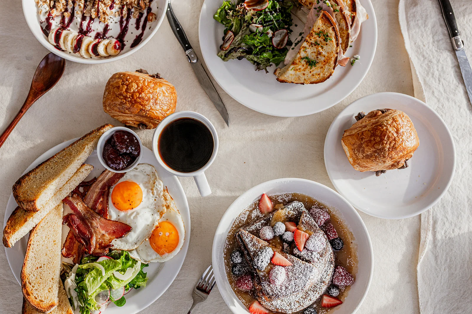 Classic American breakfast with eggs, bacon, and pancakes