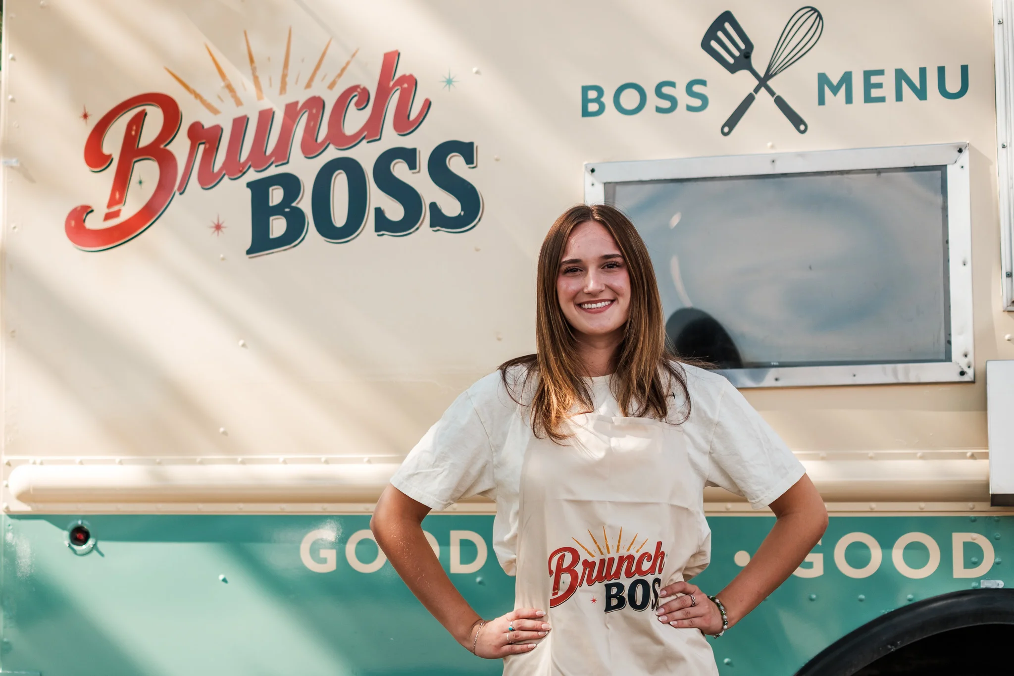 Food truck operators smiling in their vehicle