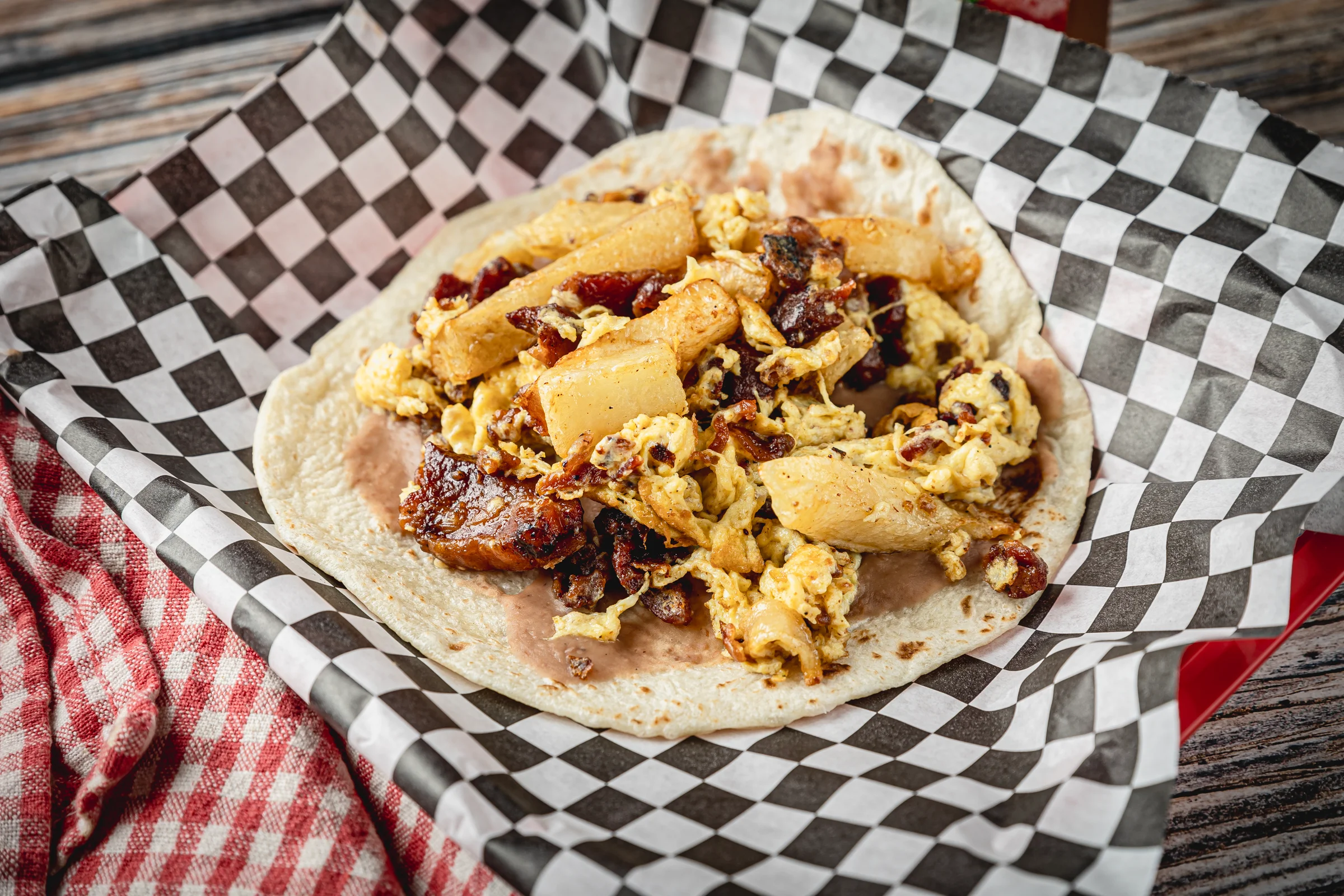 A breakfast taco packed with meat