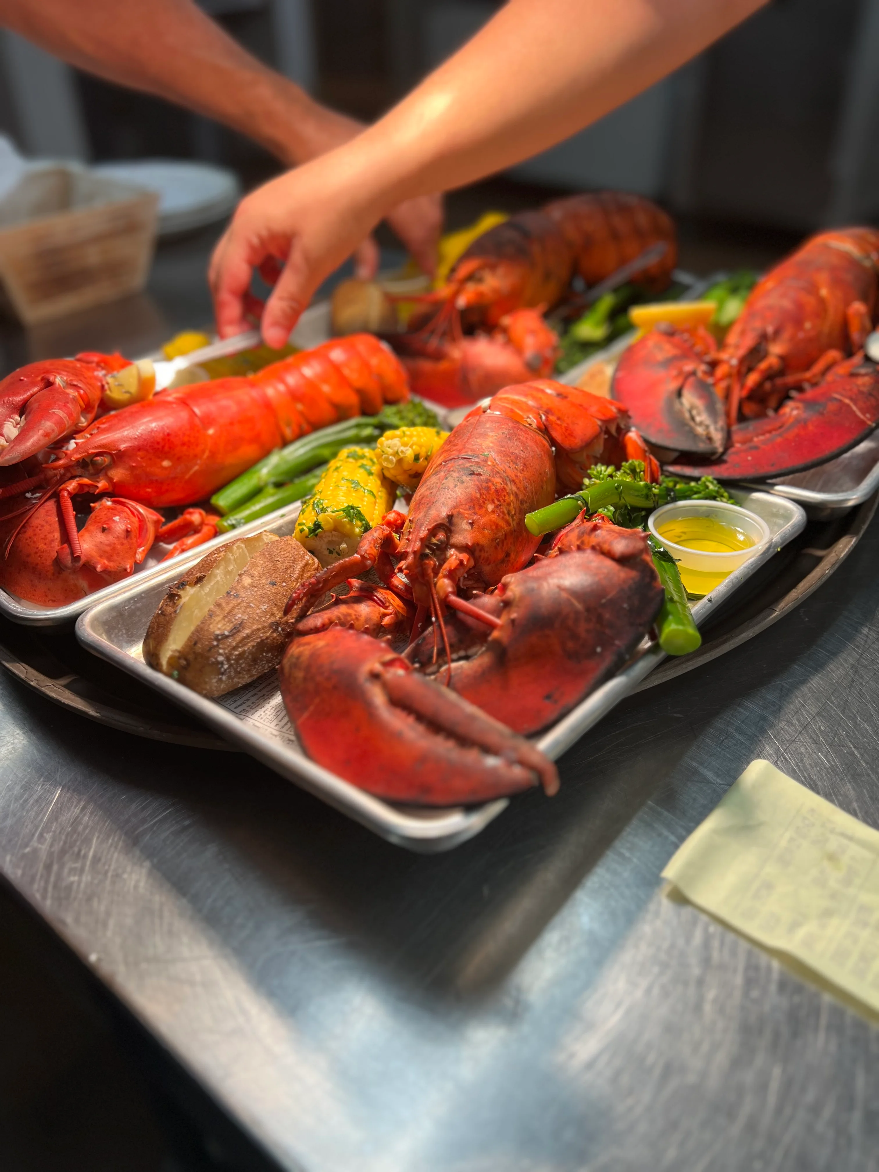 Freshly prepared New England lobster feast with sides