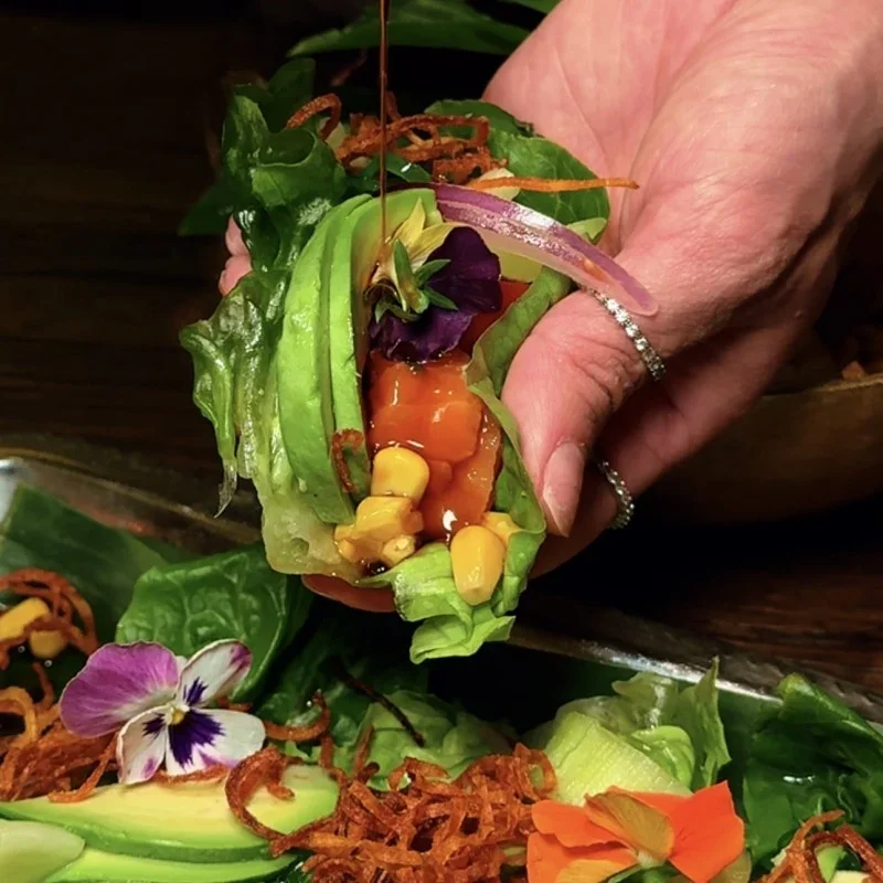 Vibrant lettuce wrap with fresh vegetables and sauce