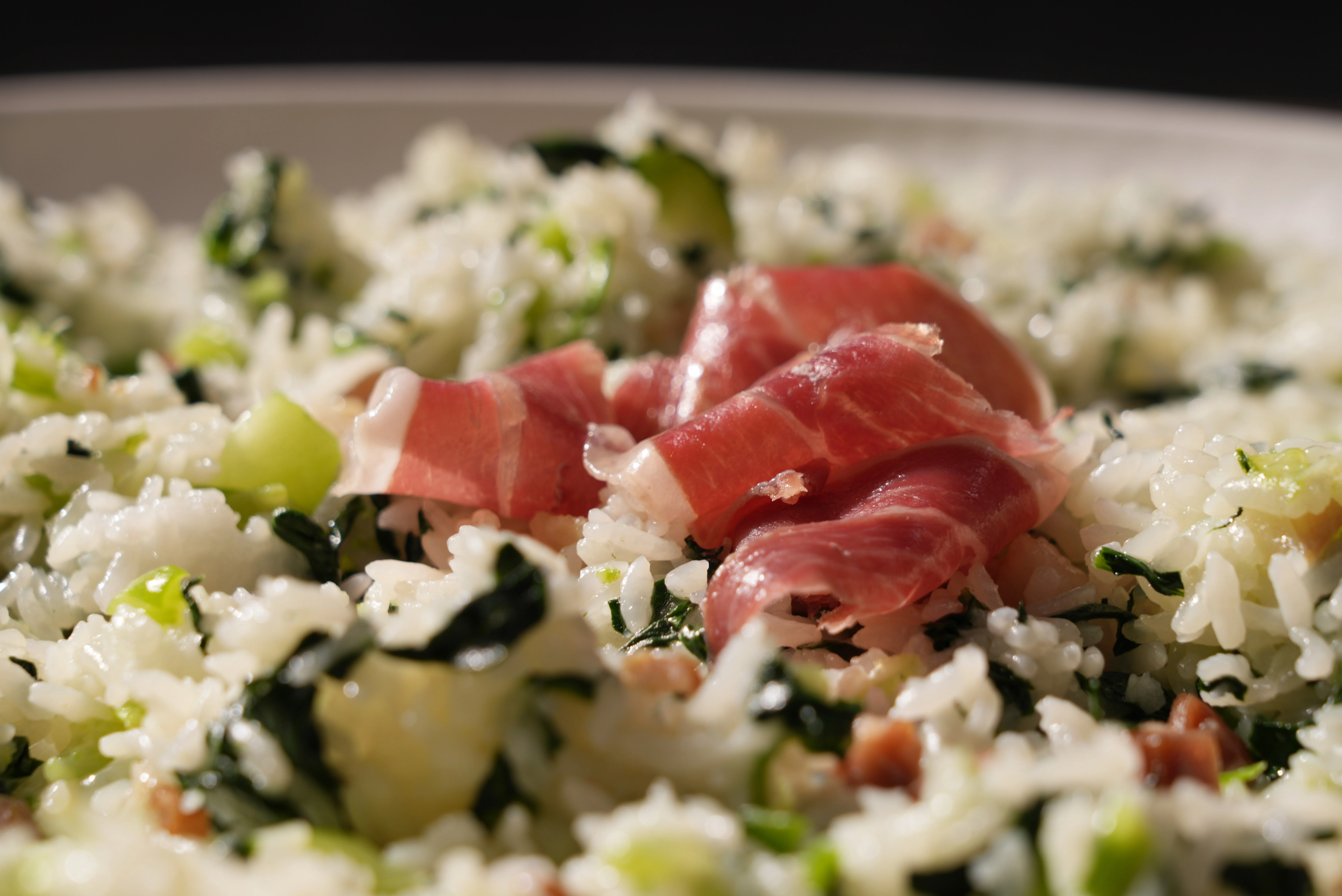 Italian risotto with prosciutto and greens