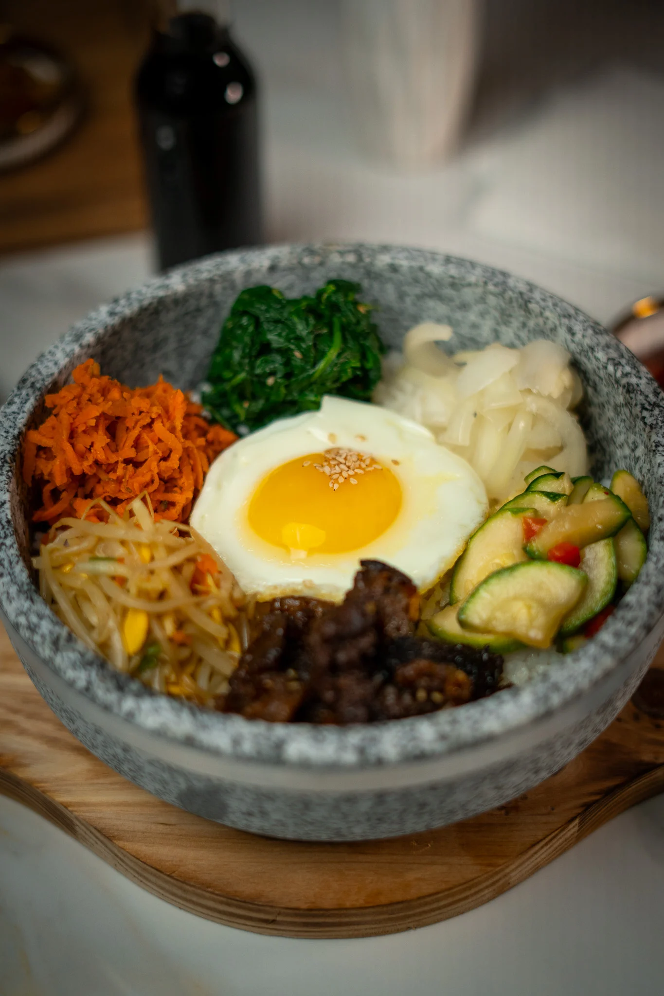 Korean bibimbap served in a stone bowl
