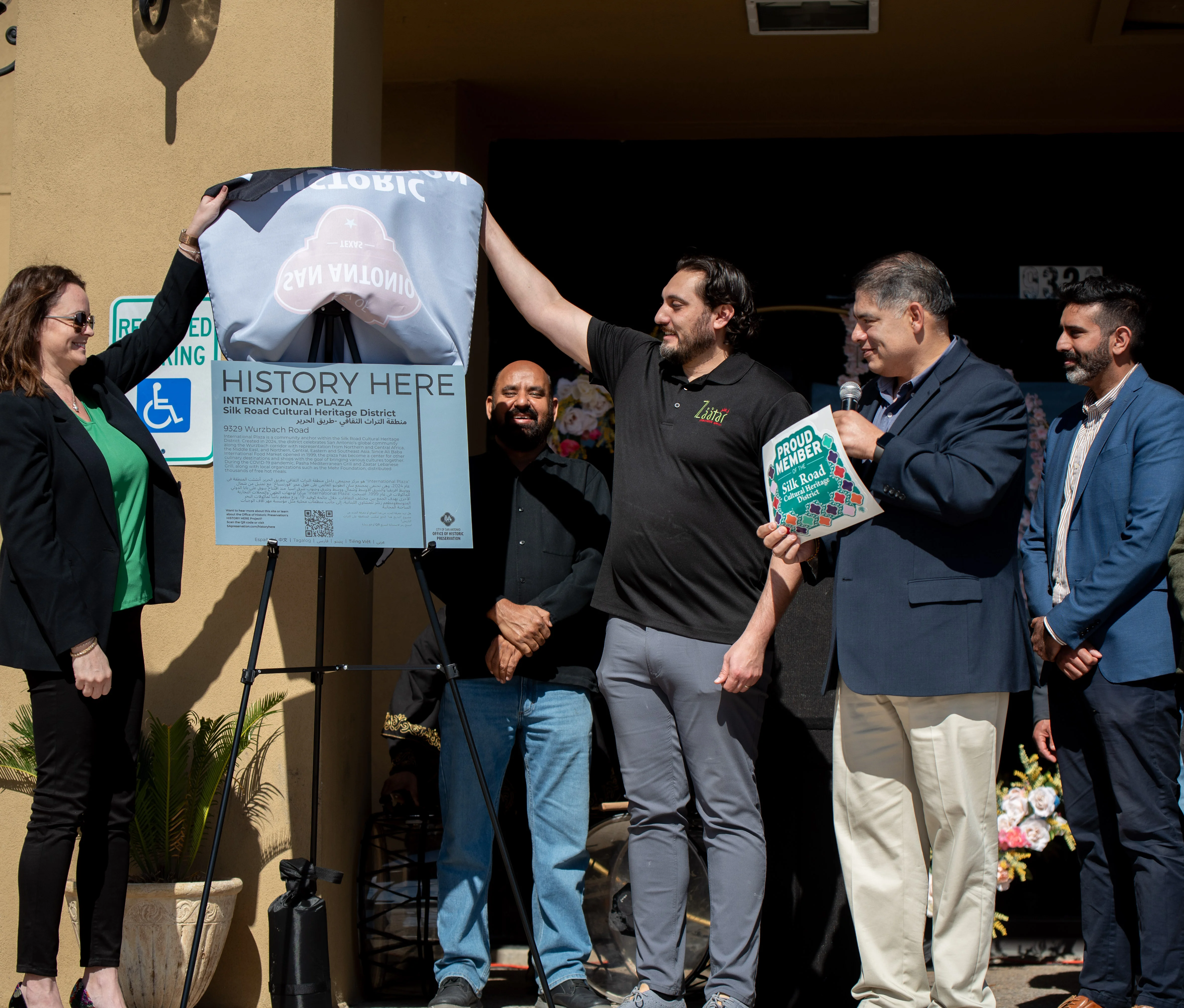 Ceremony unveiling a cultural heritage plaque at International Plaza