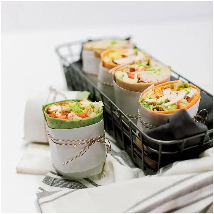 Freshly wrapped Mediterranean wraps in a basket