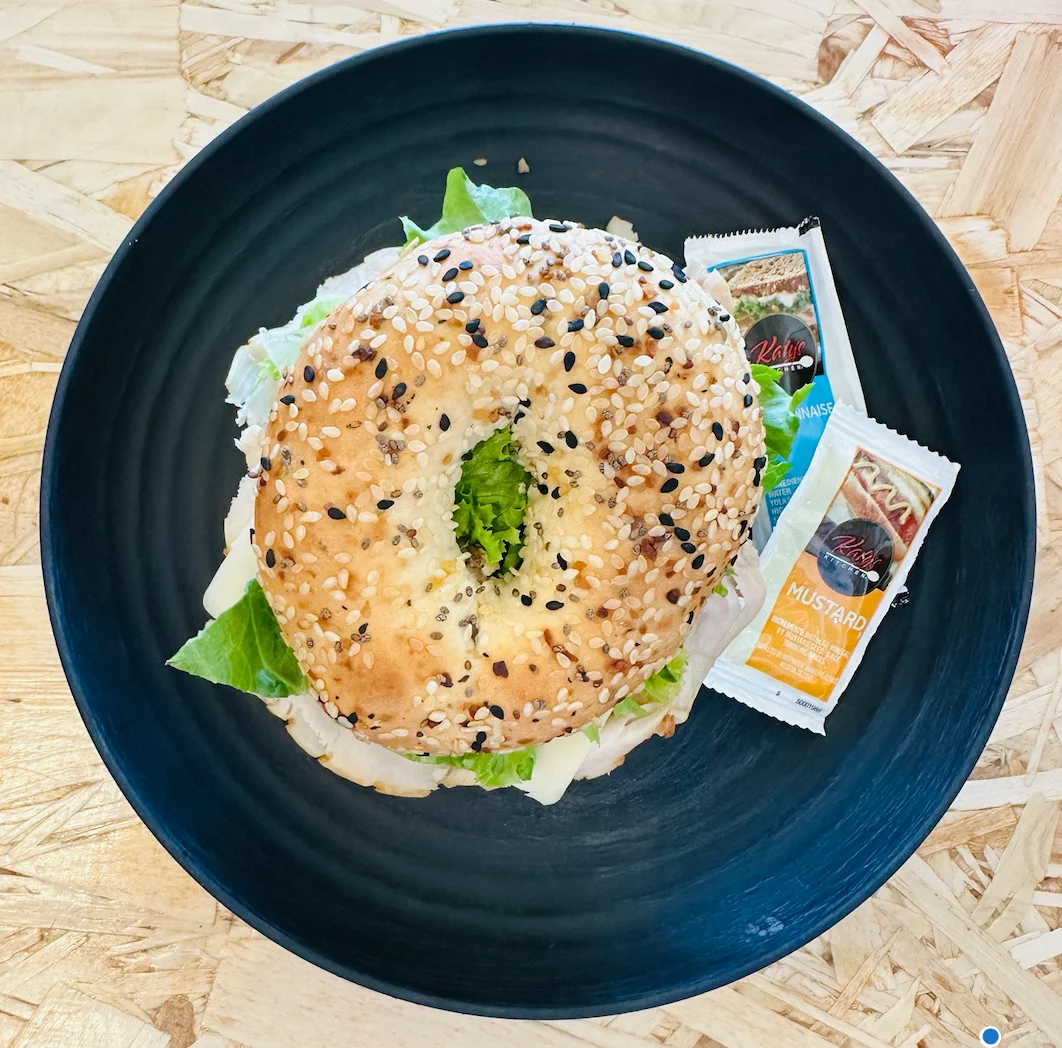 Sesame bagel sandwich with turkey and lettuce
